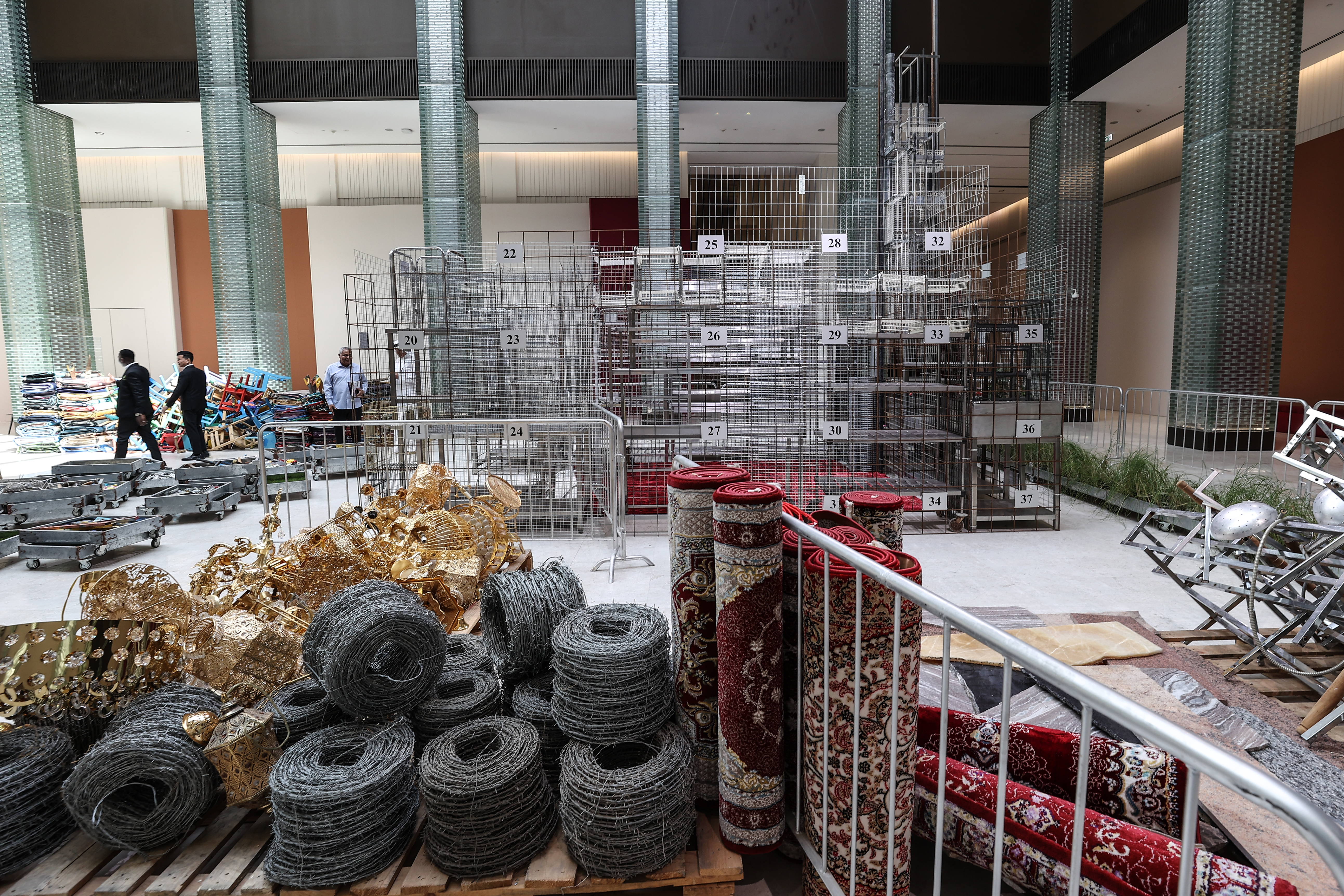 Visitors explore artworks and installations at the Art Basel Qatar Edition in Doha