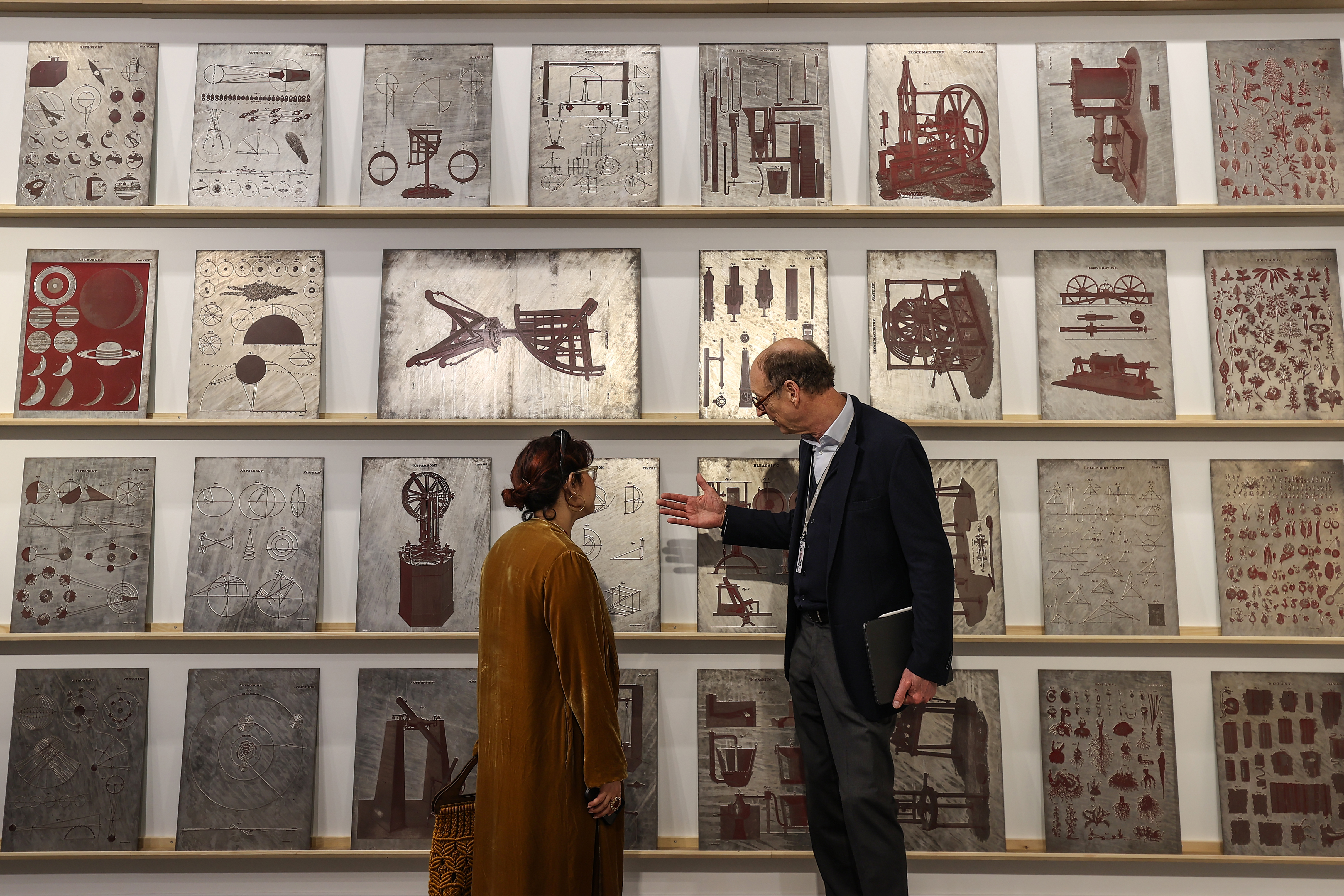 Visitors explore artworks and installations at the Art Basel Qatar Edition in Doha