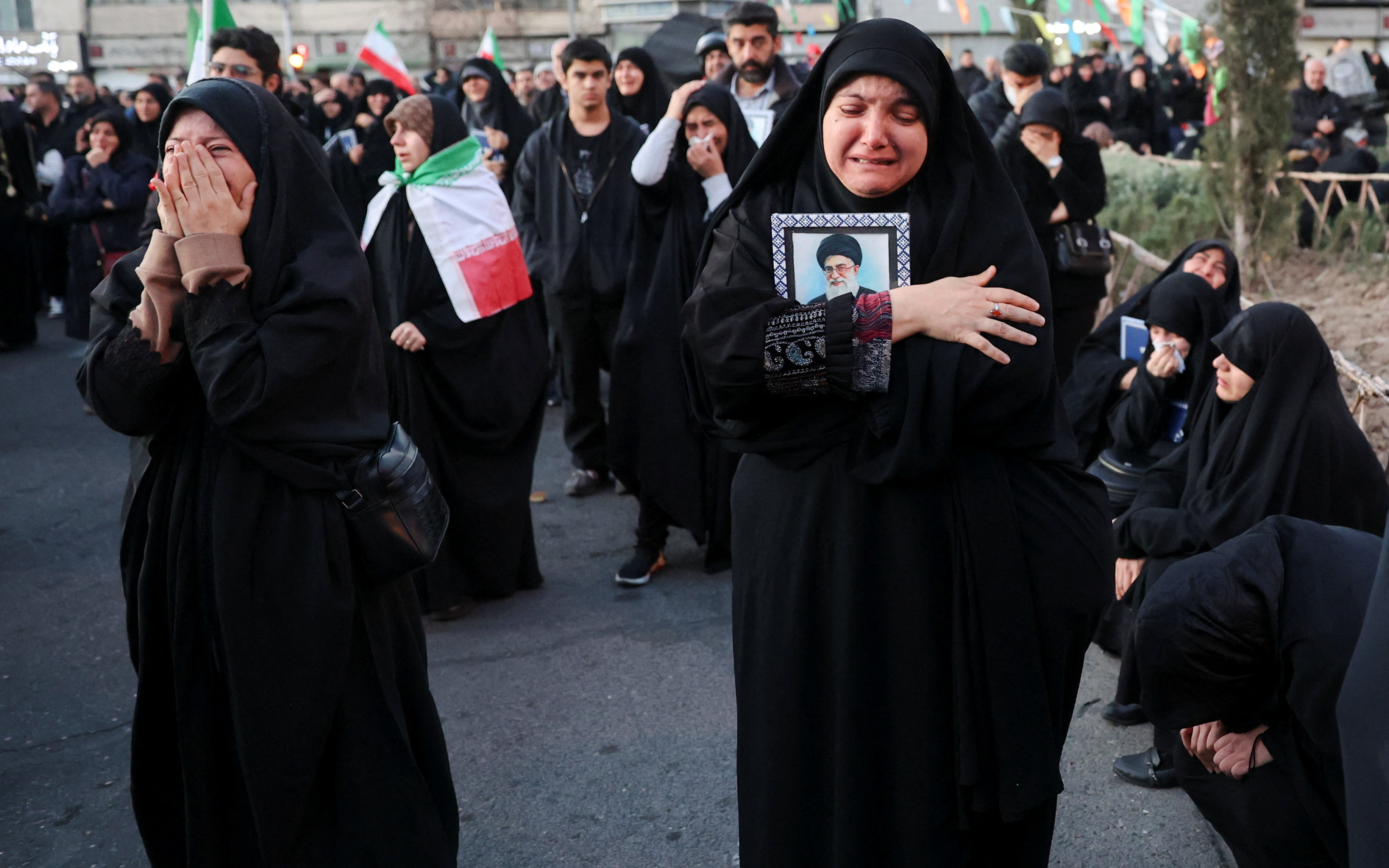 Thousands mourning Khamenei gather in Tehran square.