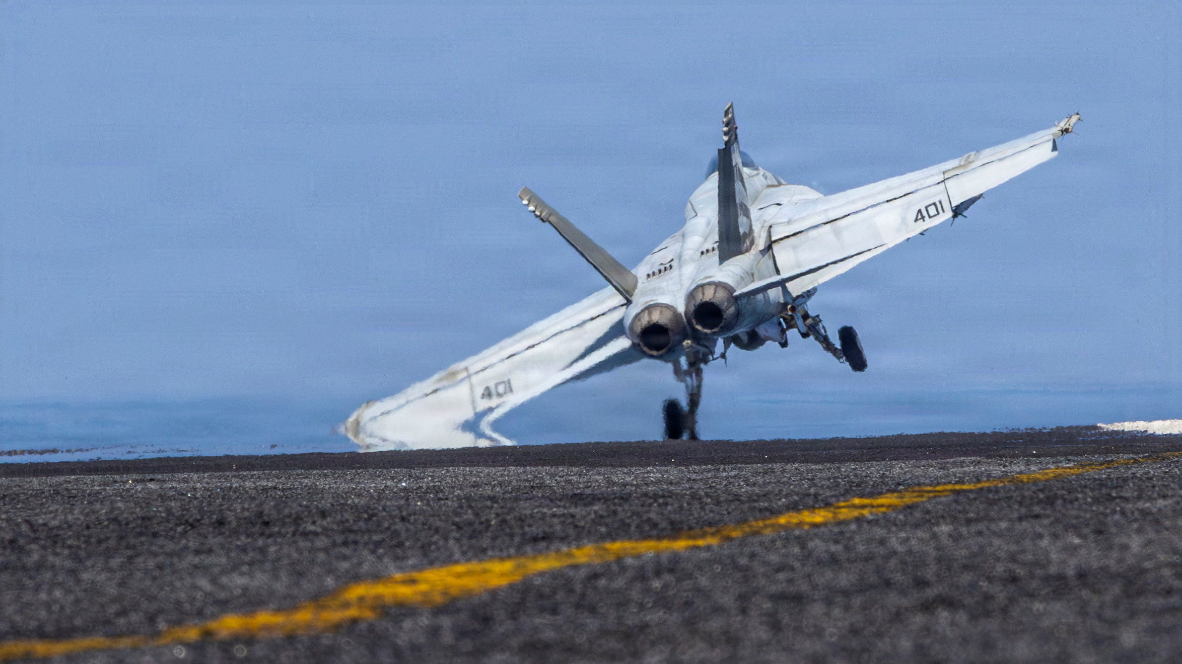 An F/A-18E Super Hornet prepares to launch from the flight deck of the U.S. Navy Nimitz-class aircraft carrier USS Abraham Lincoln in support of the Operation Epic Fury attack on Iran
