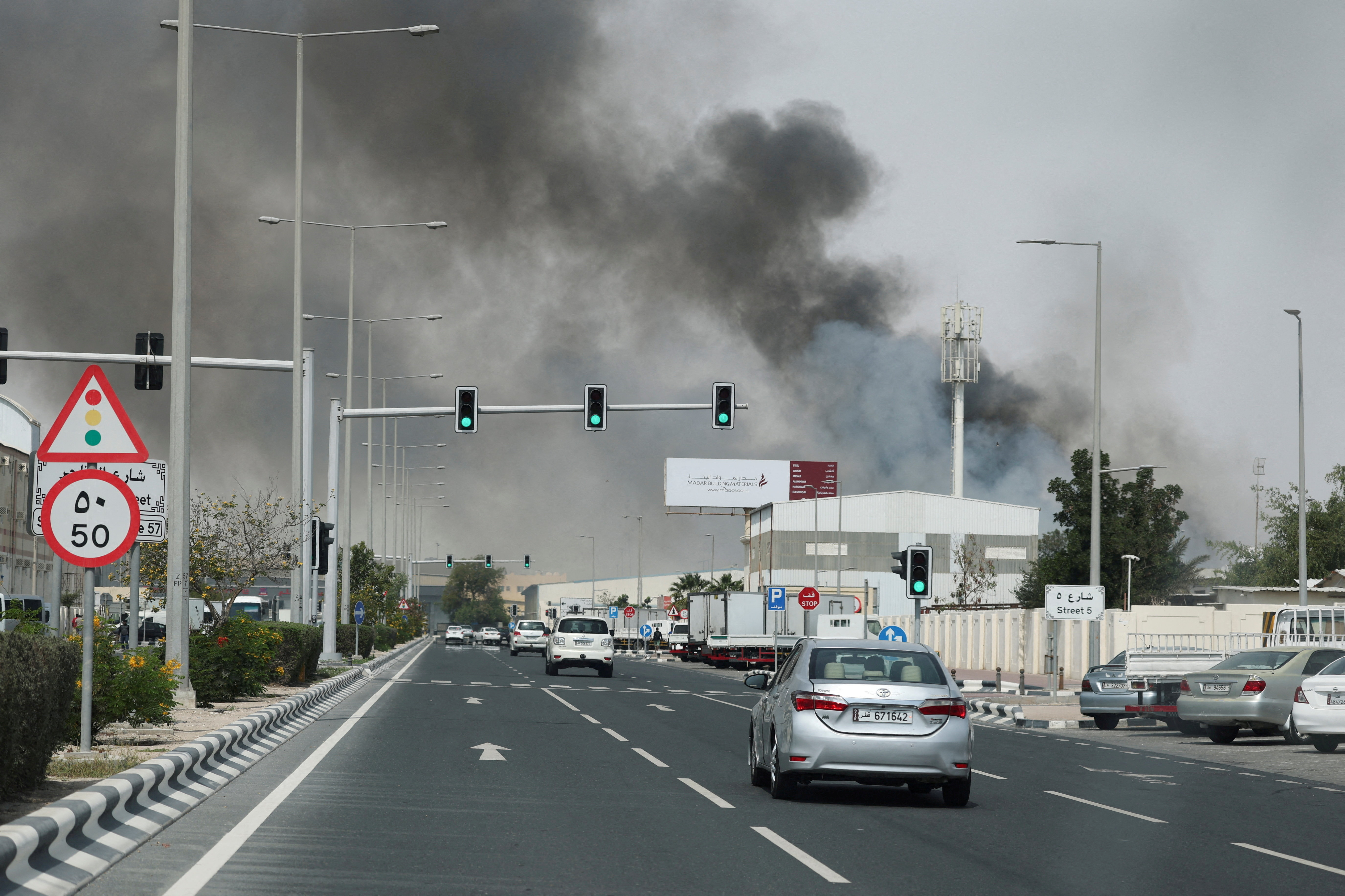 Smoke rises after reported Iranian missile attacks, following United States and Israel strikes on Iran, as seen from Doha, Qatar