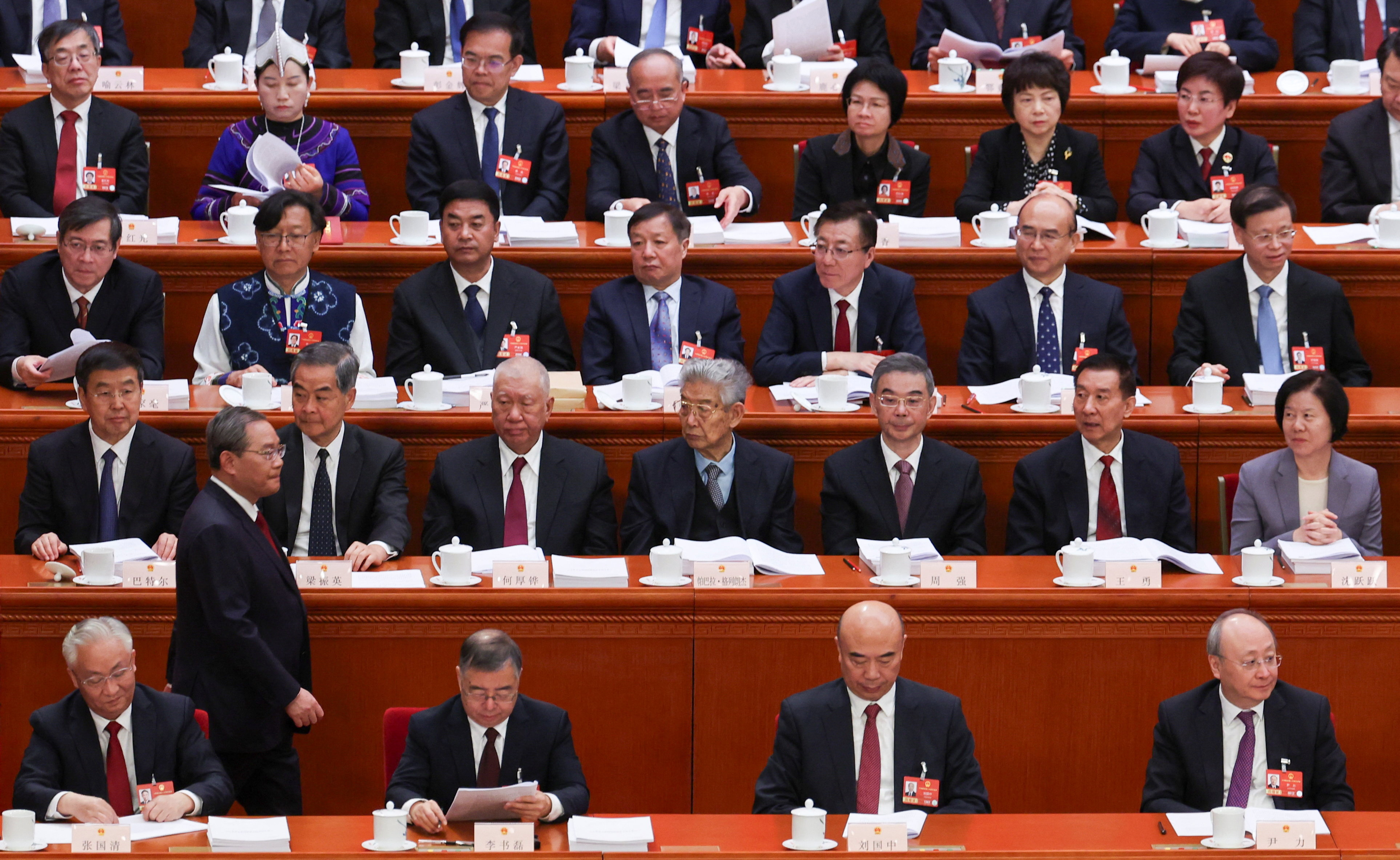 Chinese Premier Li Qiang walks back to his seat following his speech during the opening session of the National People's Congress (NPC) at the Great Hall of the People in Beijing, China, March 5, 2026. REUTERS/Florence Lo/Pool