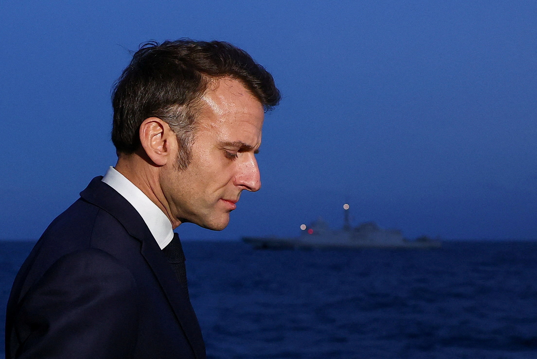 French President Emmanuel Macron arrives to speak to members of the media as he visits the French aircraft carrier Charles de Gaulle, on the day of his visit to Cyprus, showing France's solidarity after recent drone attacks amid the U.S.-Israeli conflict with Iran, and aimed at reinforcing European security in the Eastern Mediterranean, on the Mediterranean Sea, March 9, 2026. REUTERS/Gonzalo Fuentes/Pool TPX IMAGES OF THE DAY