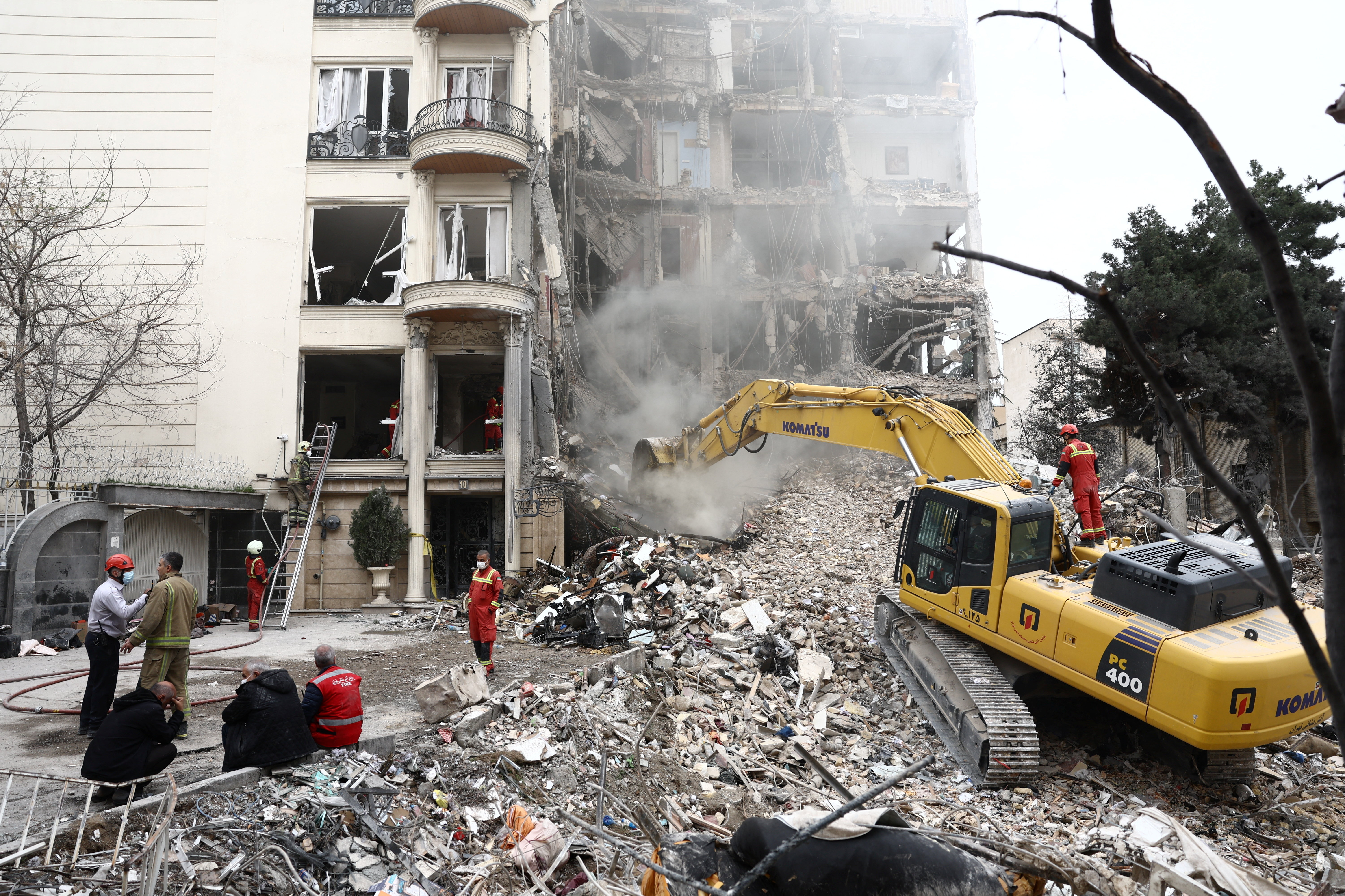 Emergency personnel work at the site of a strike on a residential building, amid the U.S.-Israeli conflict with Iran, in Tehran, Iran, March 23, 2026. Majid Asgaripour/WANA (West Asia News Agency) via REUTERS ATTENTION EDITORS - THIS PICTURE WAS PROVIDED BY A THIRD PARTY