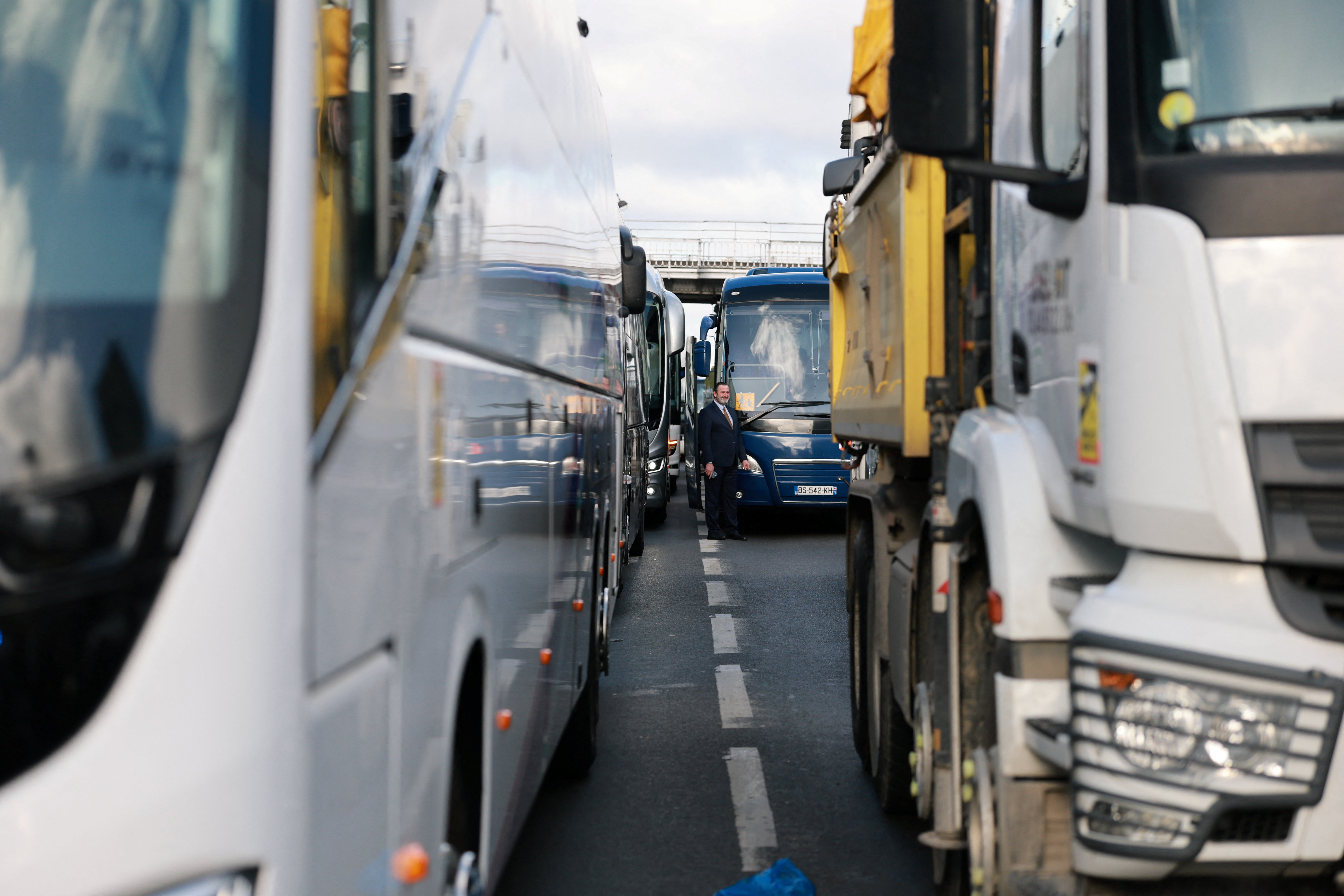 Buses and trucks are parked on the Cours de Vincennes before a demonstration by truck drivers and bus drivers on the Paris ring road over fuel prices