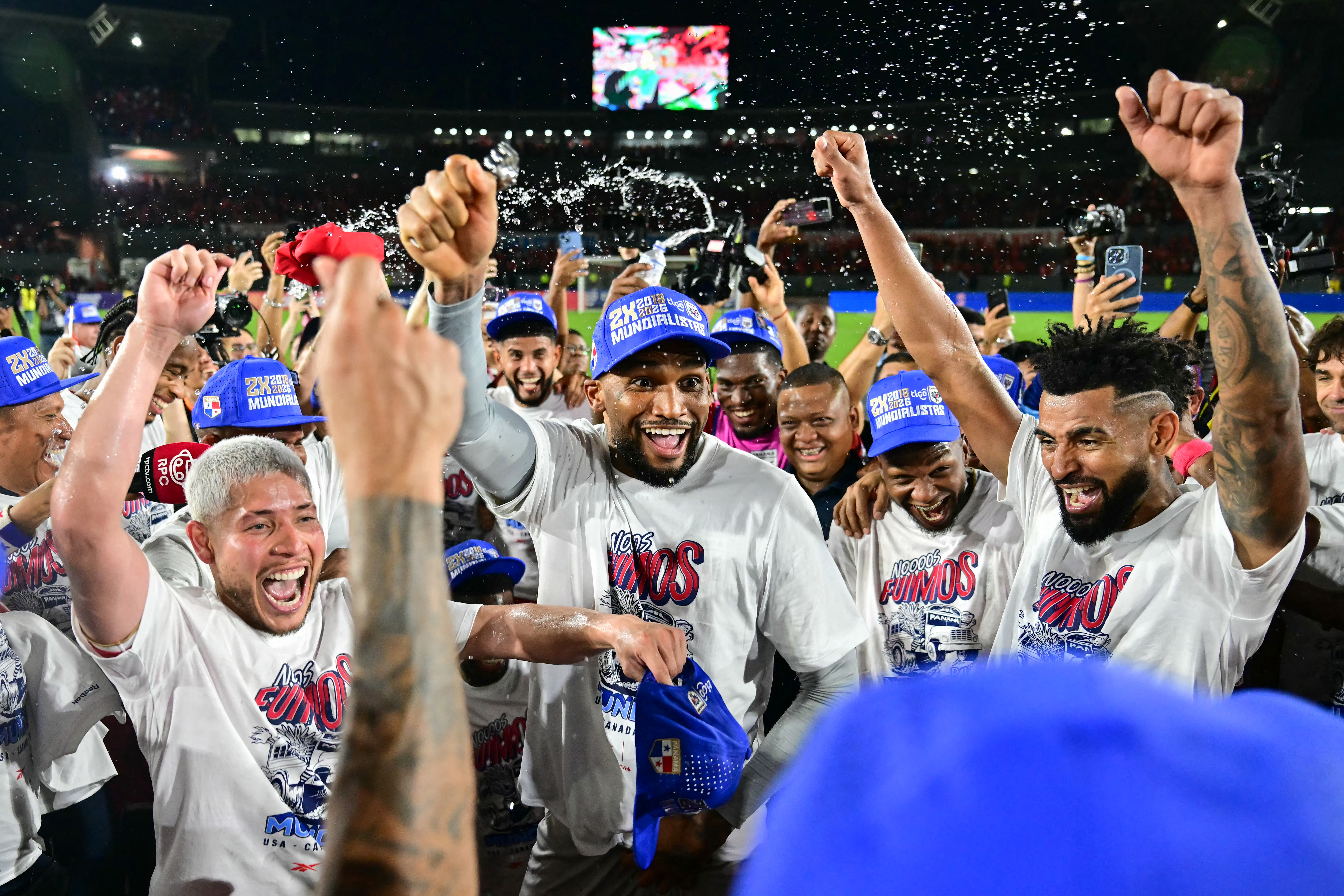 Panama players celebrate after winning the 2026 FIFA World Cup Concacaf qualifier football match between Panama and El Salvador at the Rommel Fernandez Stadium in Panama City on November 18, 2025. (Photo by MARTIN BERNETTI / AFP)