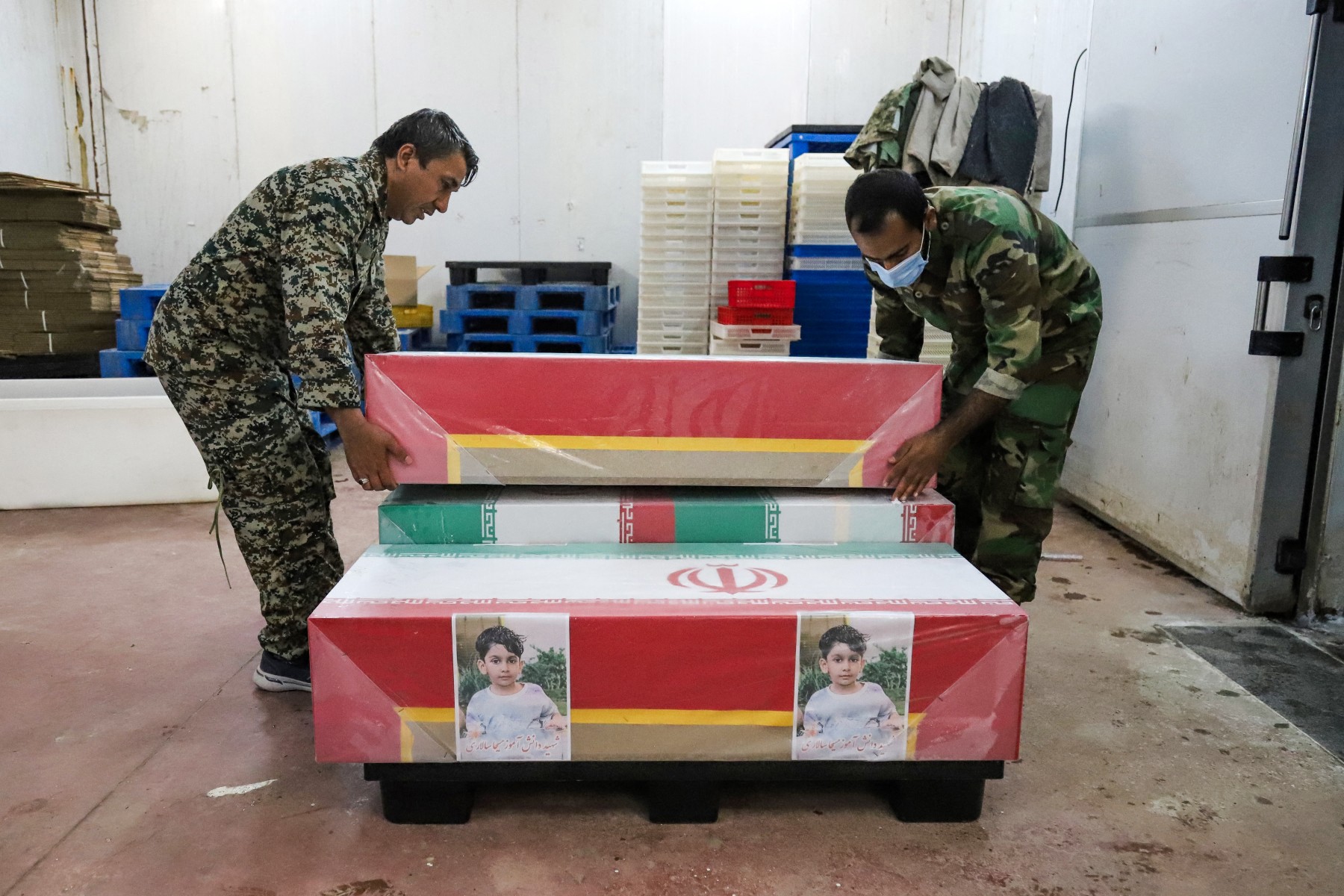In this picture obtained from Iran's ISNA news agency, mourners prepare the coffins of children who were killed in a reported strike on a primary school in Iran’s Hormozgan province for a funeral in Minab on March 3, 2026. Iranian media have reported hundreds of Iranian casualties, including at a girl's school, although AFP reporters have not been able to verify tolls independently. The war launched by the United States and Israel against Iran spread across the Middle East, threatening to plunge the global economy into chaos, with Lebanon and Gulf energy exporters dragged into the conflict.