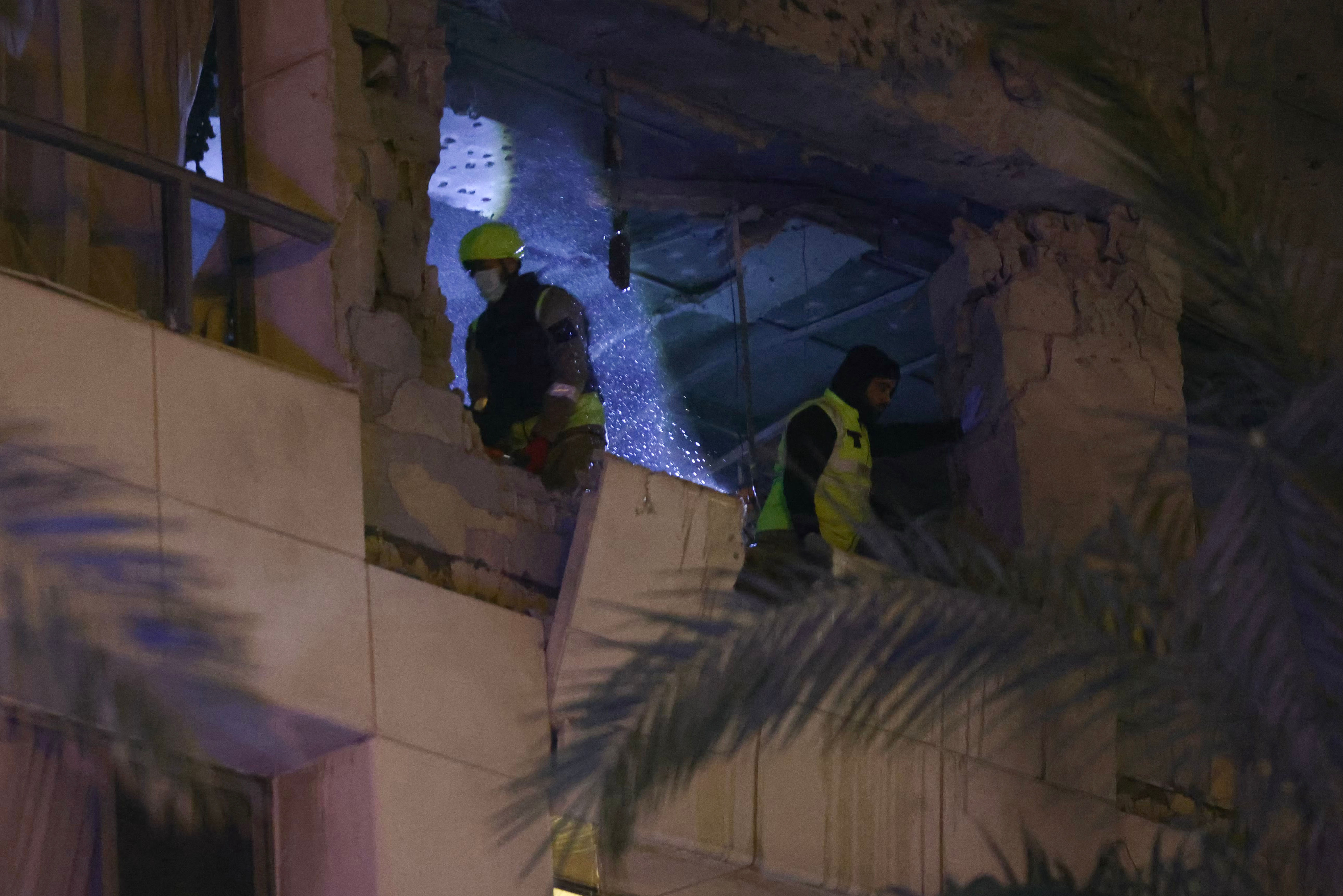First aid responders inspect a Ramada hotel room targeted by an Israeli strike, in Beirut’s seaside Rawche area, on March 8, 2026. [Ibrahim Amro/AFP]