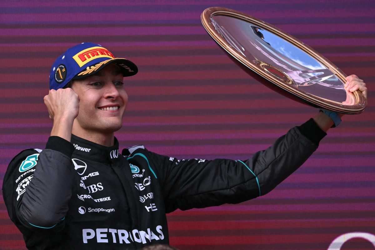 Mercedes' British driver George Russell celebrates on the podium after winning the Formula One Australian Grand Prix at the Albert Park Circuit in Melbourne on March 8, 2026. (Photo by WILLIAM WEST / AFP) / -- IMAGE RESTRICTED TO EDITORIAL USE - STRICTLY NO COMMERCIAL USE --