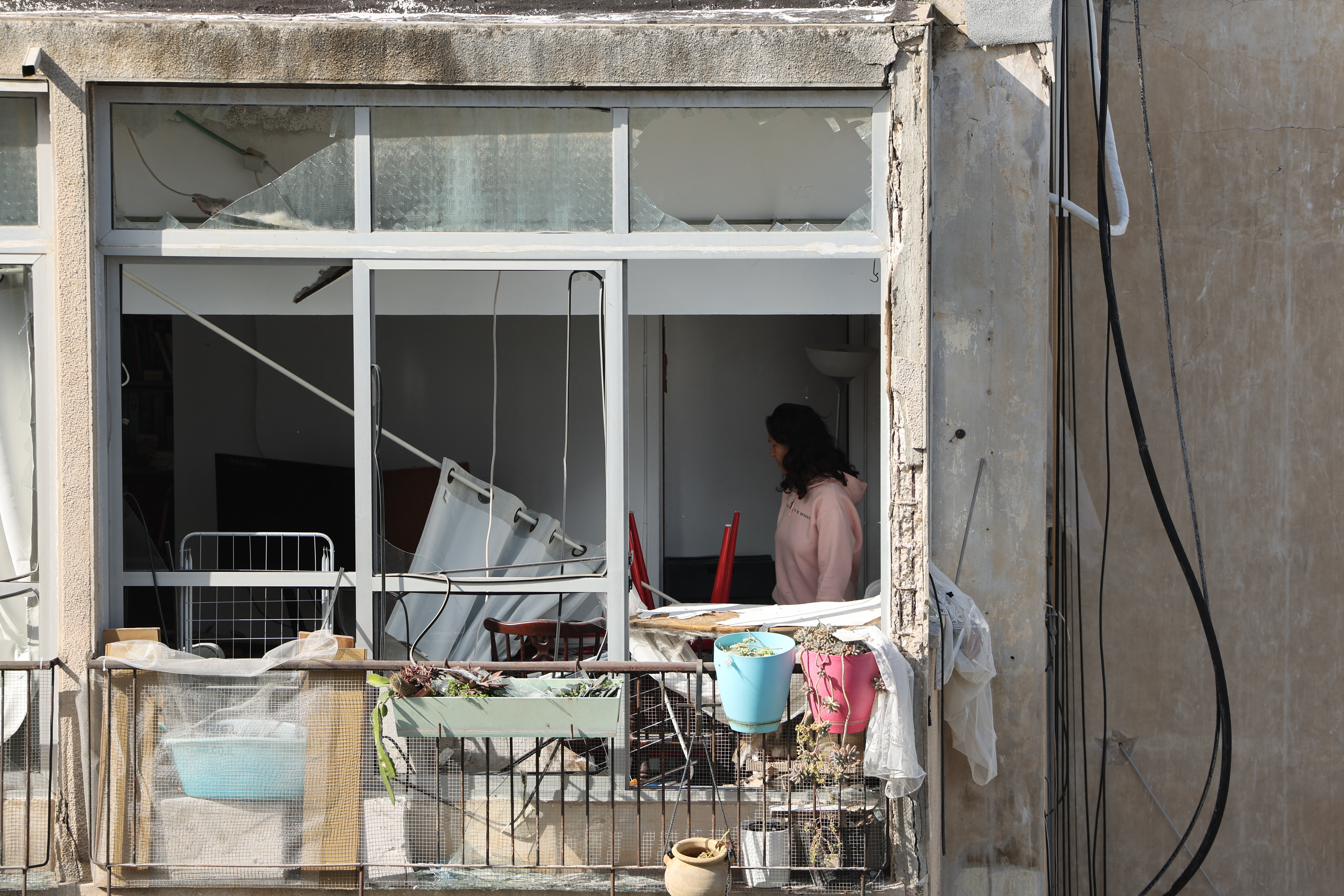 This picture shows damaged buildings at the site of an Iranian missile strike in Tel Aviv