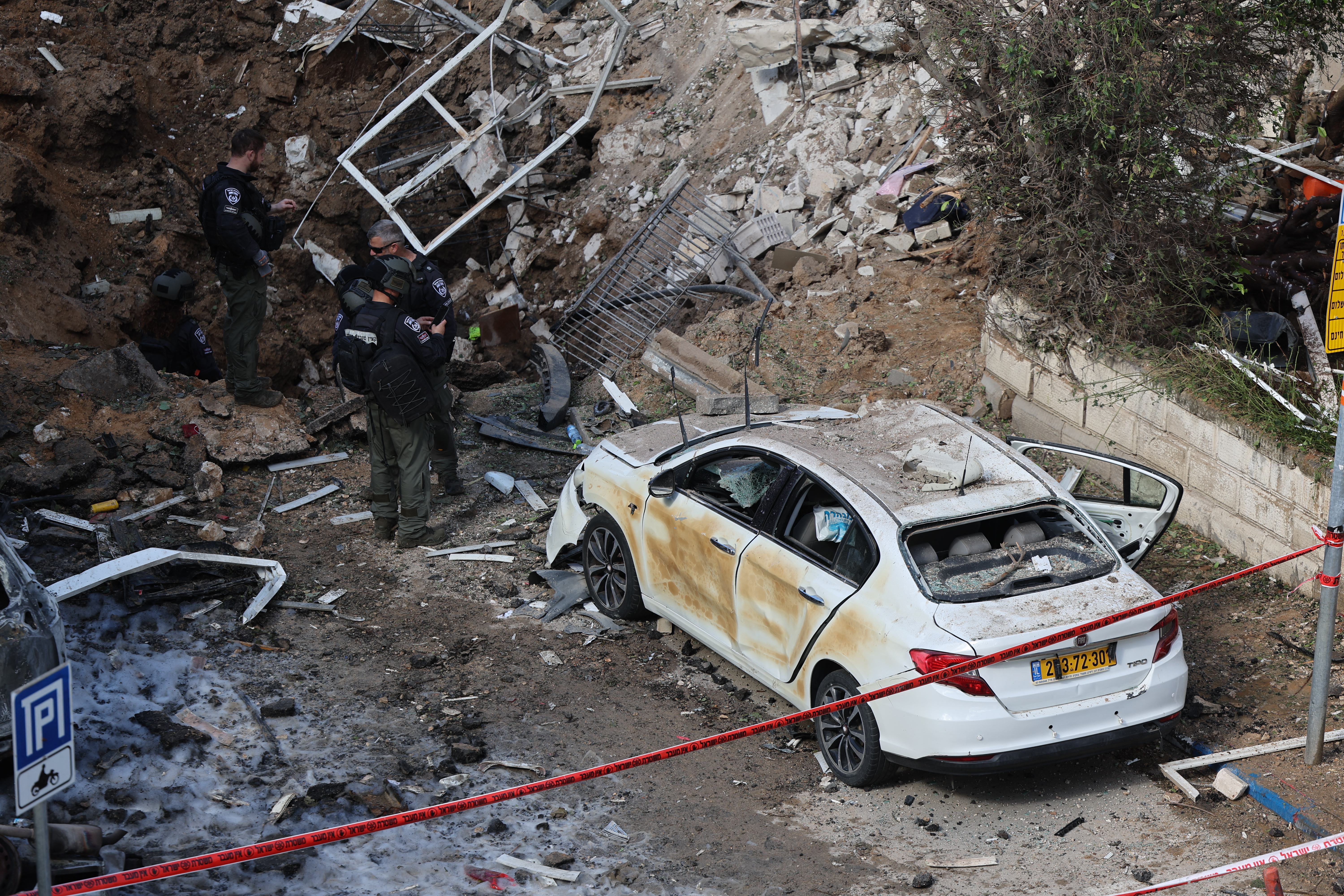 This picture shows damaged buildings at the site of an Iranian missile strike in Tel Aviv