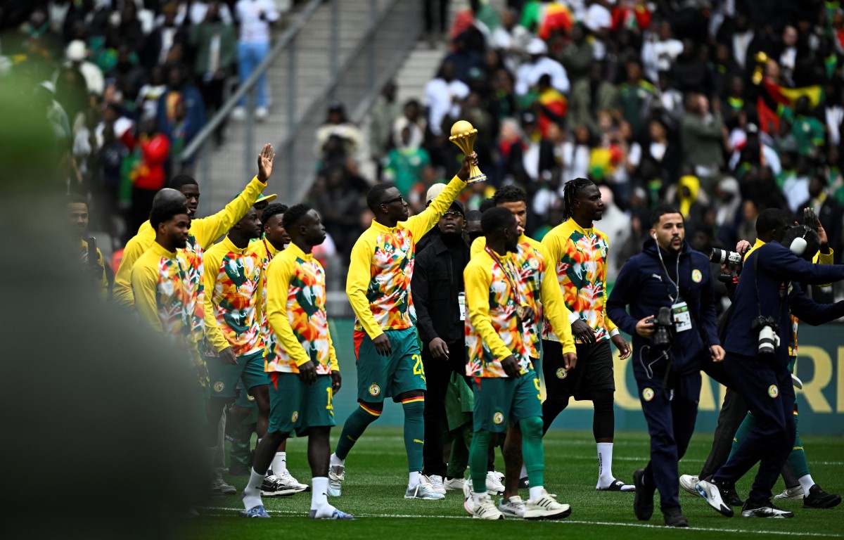 Senegal's players parade with The African Cup of Nations trophy ahead of the international friendly football match between Senegal and Peru