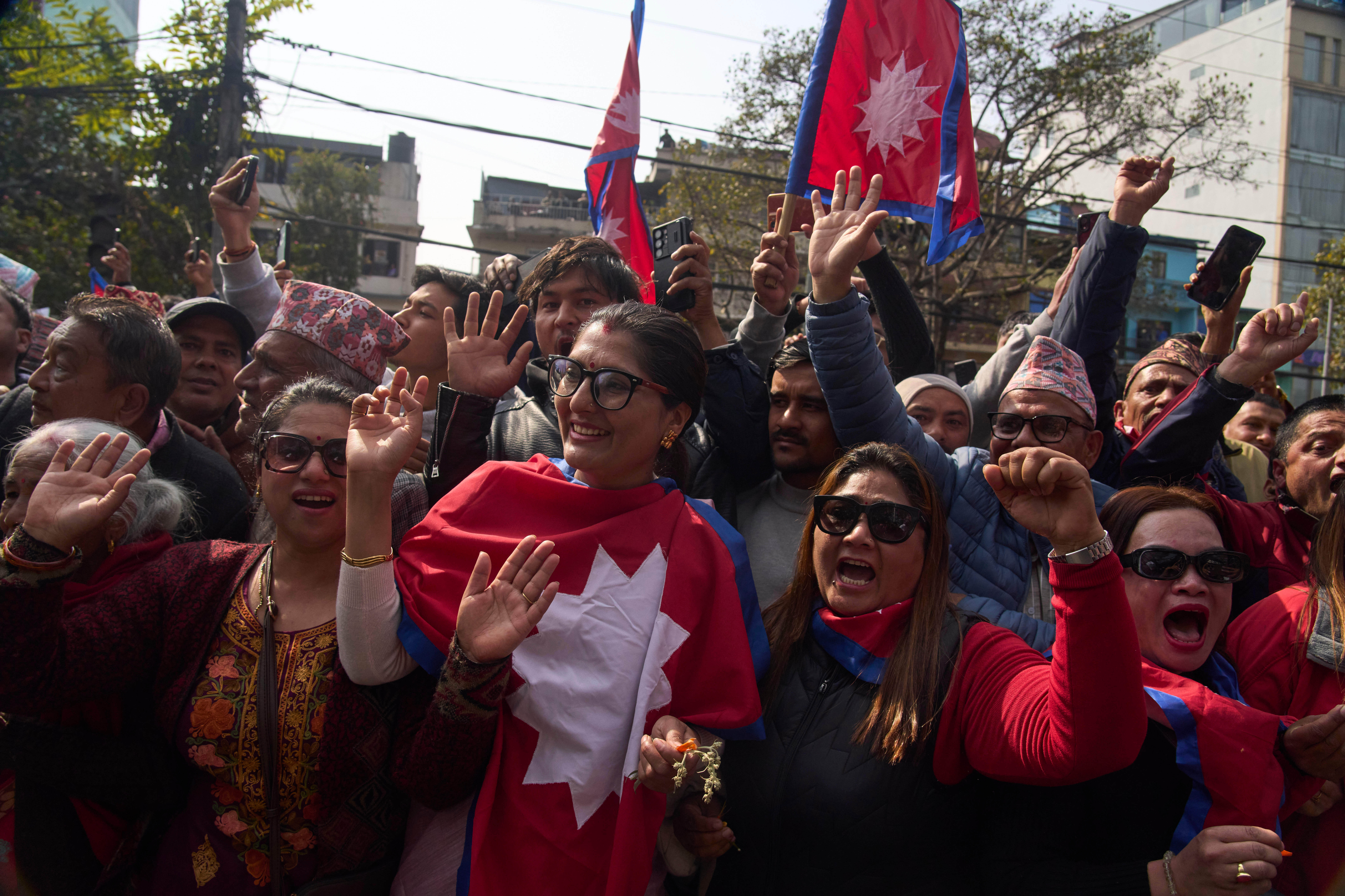 Supporters gather to welcome Nepal's former King Gyanendra Shah upon his arrival at Tribhuvan International Airport in Kathmandu, Nepal, Friday, Feb. 13, 2026. (AP Photo/Niranjan Shrestha)