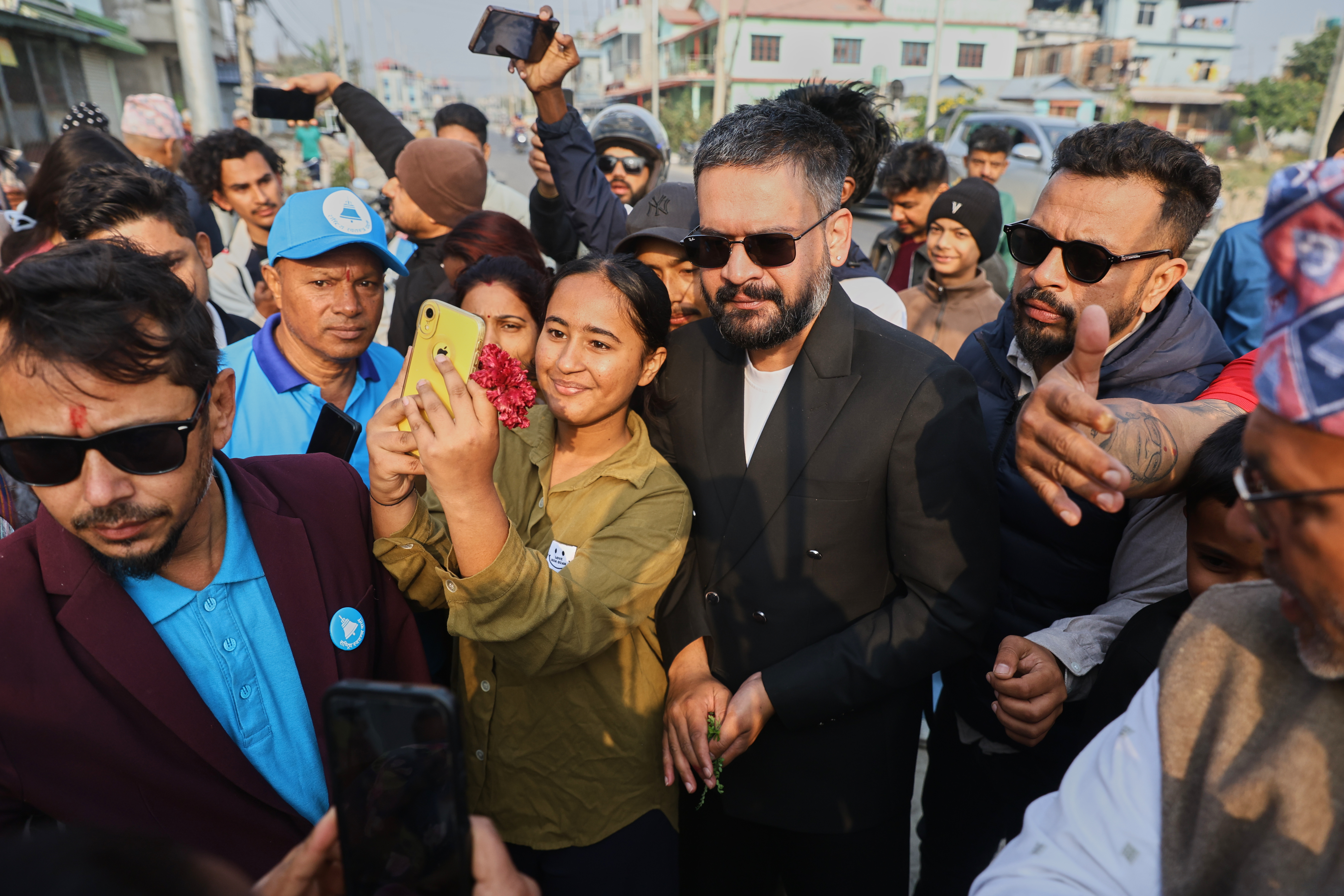 Former Kathmandu Mayor Balendra Shah, center right, the prime ministerial candidate of the Rastriya Swatantra Party, meets supporters during an election campaign rally in Jhapa, Nepal, Monday, Feb. 23, 2026. (AP Photo/Umesh Karki)