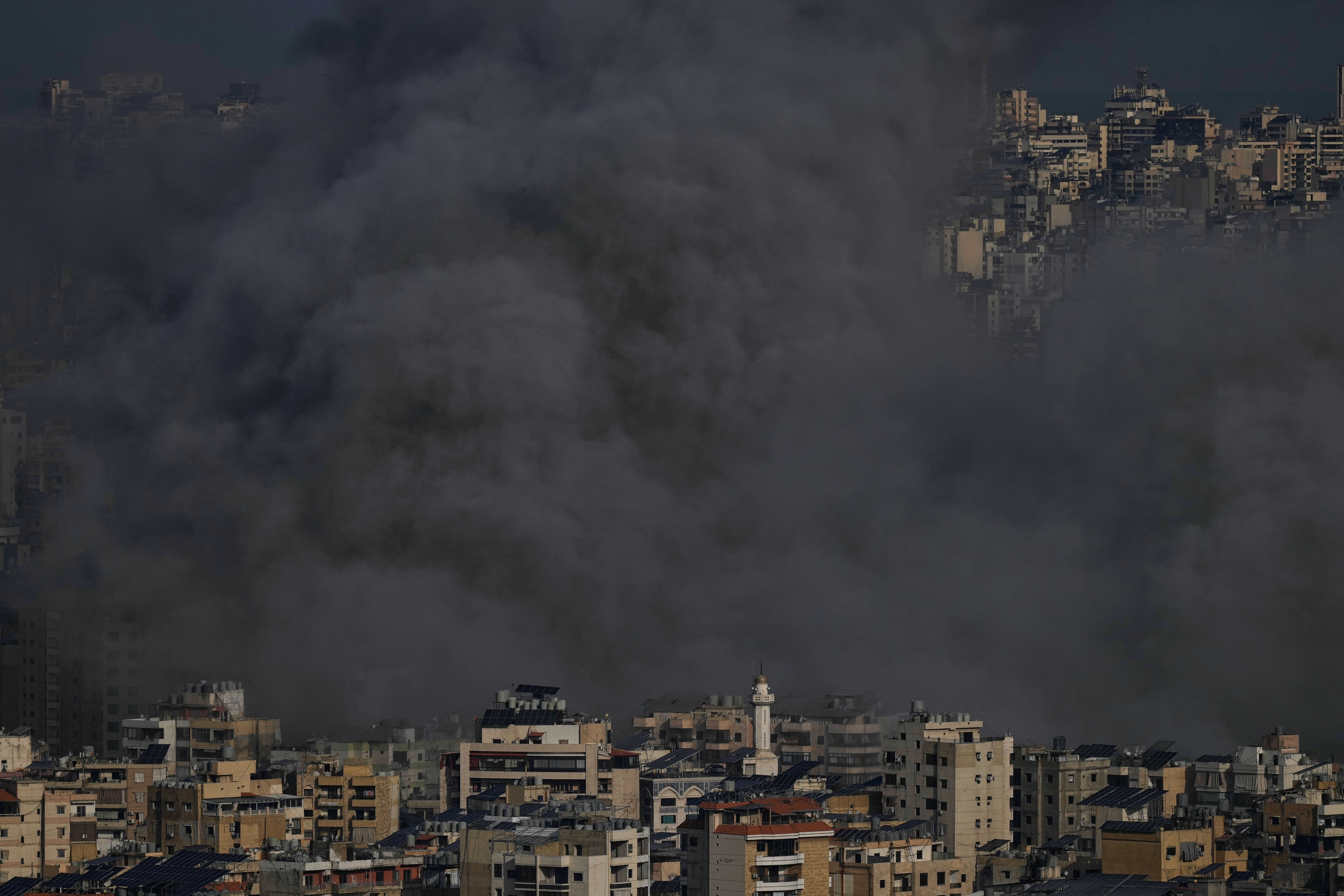 Smoke rises following an Israeli airstrike in Dahiyeh