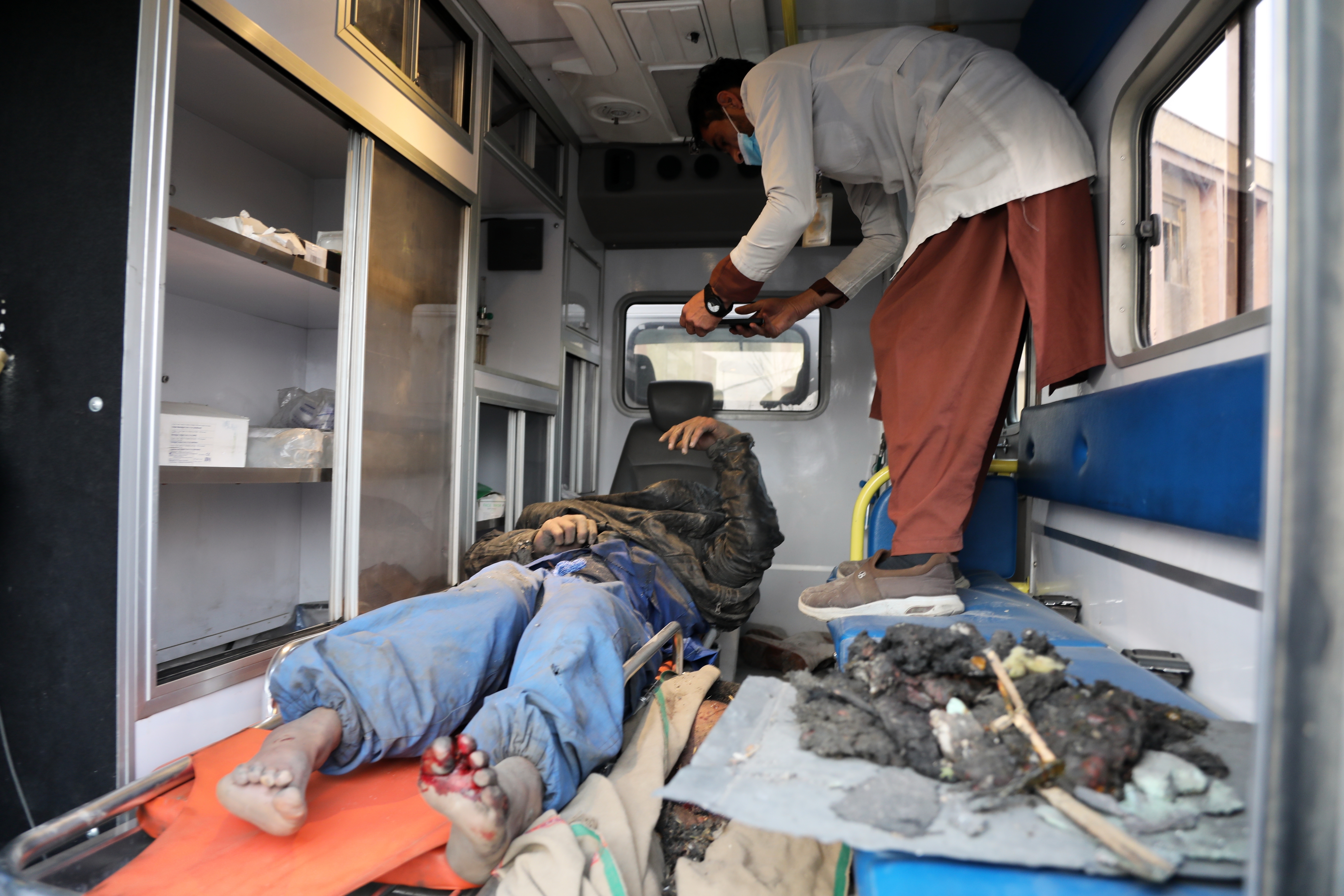 Rescue teams recover bodies after Kabul hospital airstrike tragedy