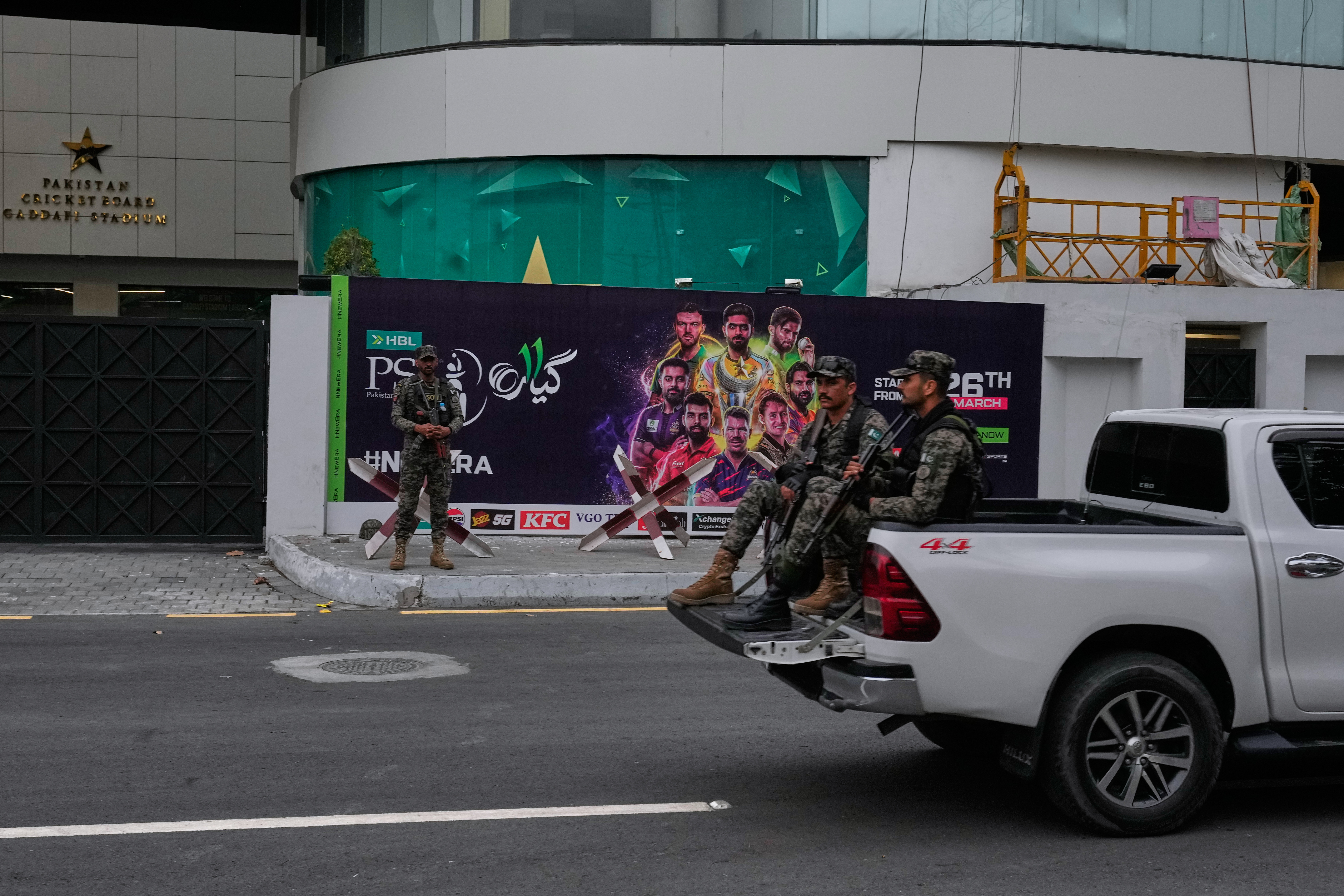 Paramilitary soldiers patrol to ensure security at outside the Gaddafi Stadium, where opening cricket match of the Pakistan Super League between Lahore Qalandars and Hyderabad Kingsmen is taking place without spectators