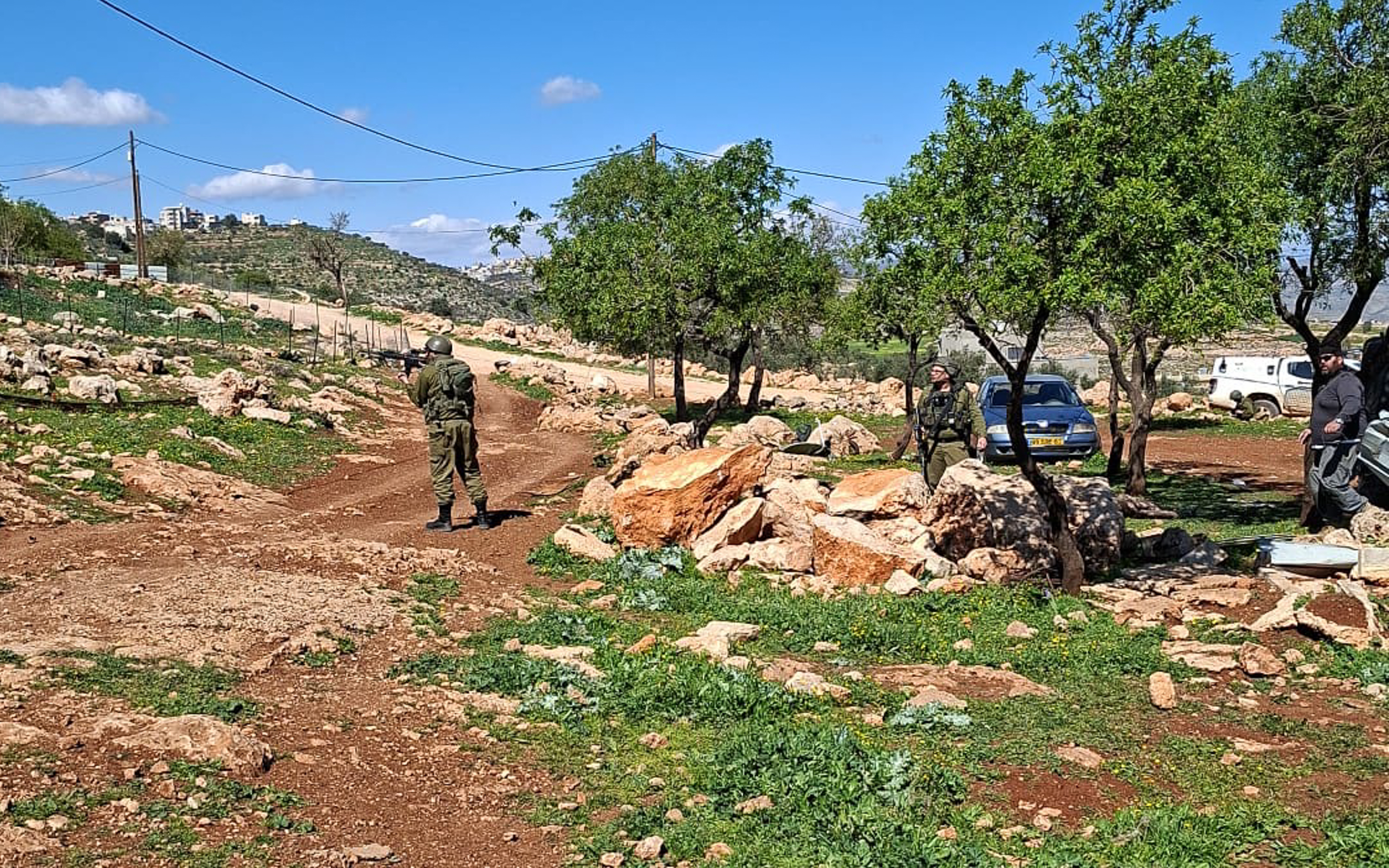Soldier pointing gun at Palestinians during Sunday attack PC Herd of Justice-1772695925