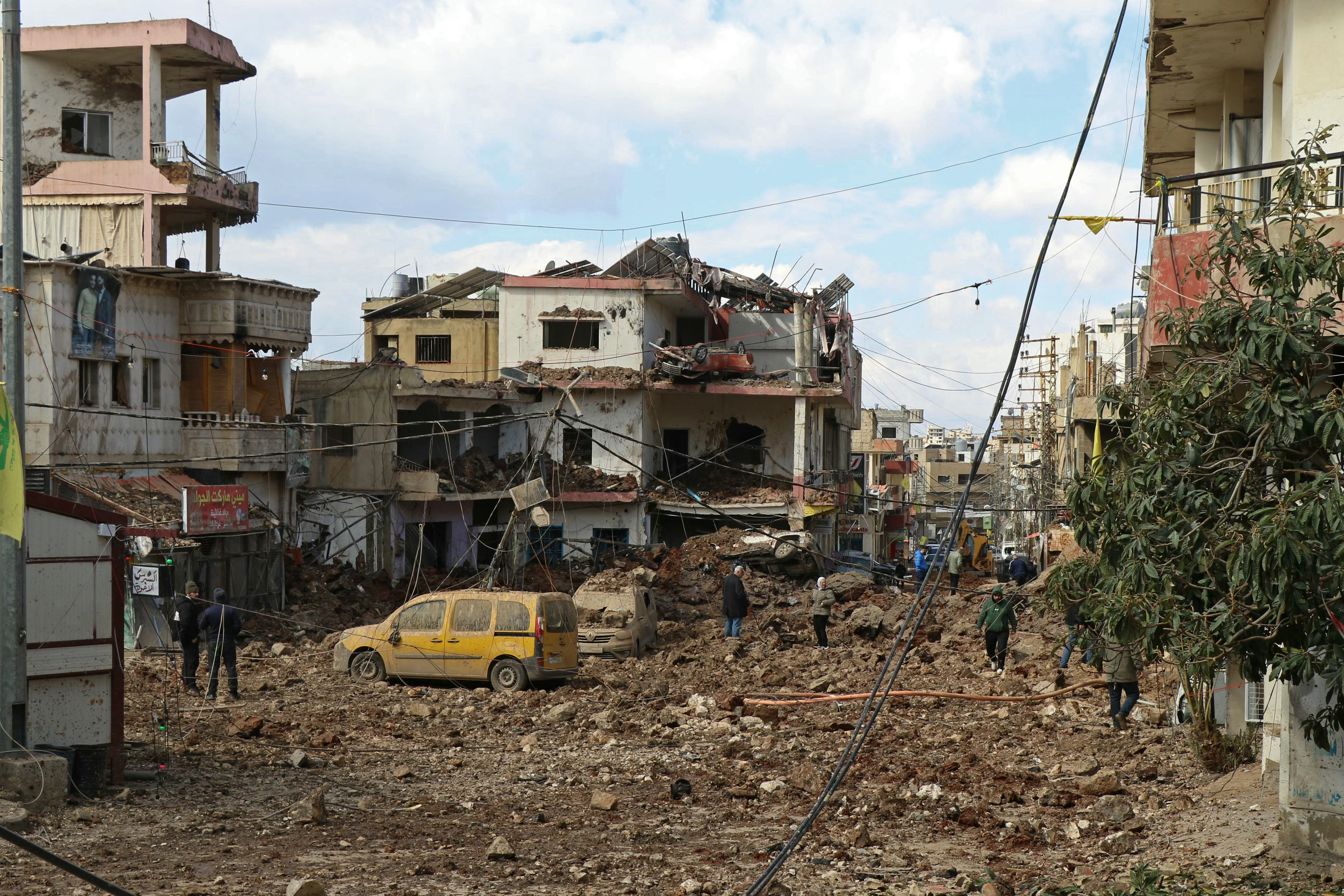 This photograph taken during a media tour organised by the Hezbollah shows people inspecting the destruction at Nabi Sheet town after an Israeli military operation in the Bekaa Valley of Lebanon, on March 7, 2026.
