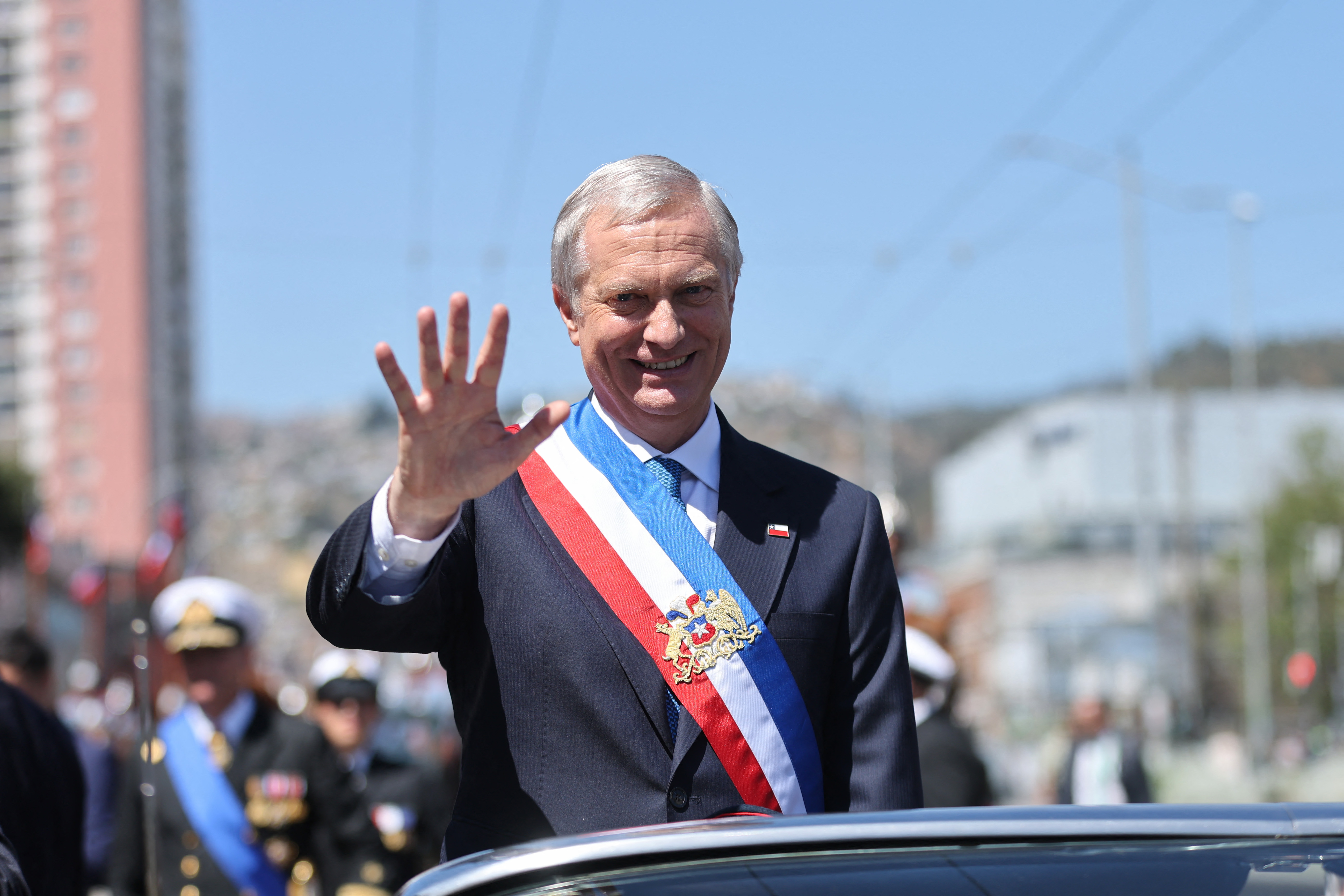 Chile's new President Jose Antonio Kast waves from the presidential convertible car after his inauguration ceremony in Valparaiso, Chile, on March 11, 2026.
