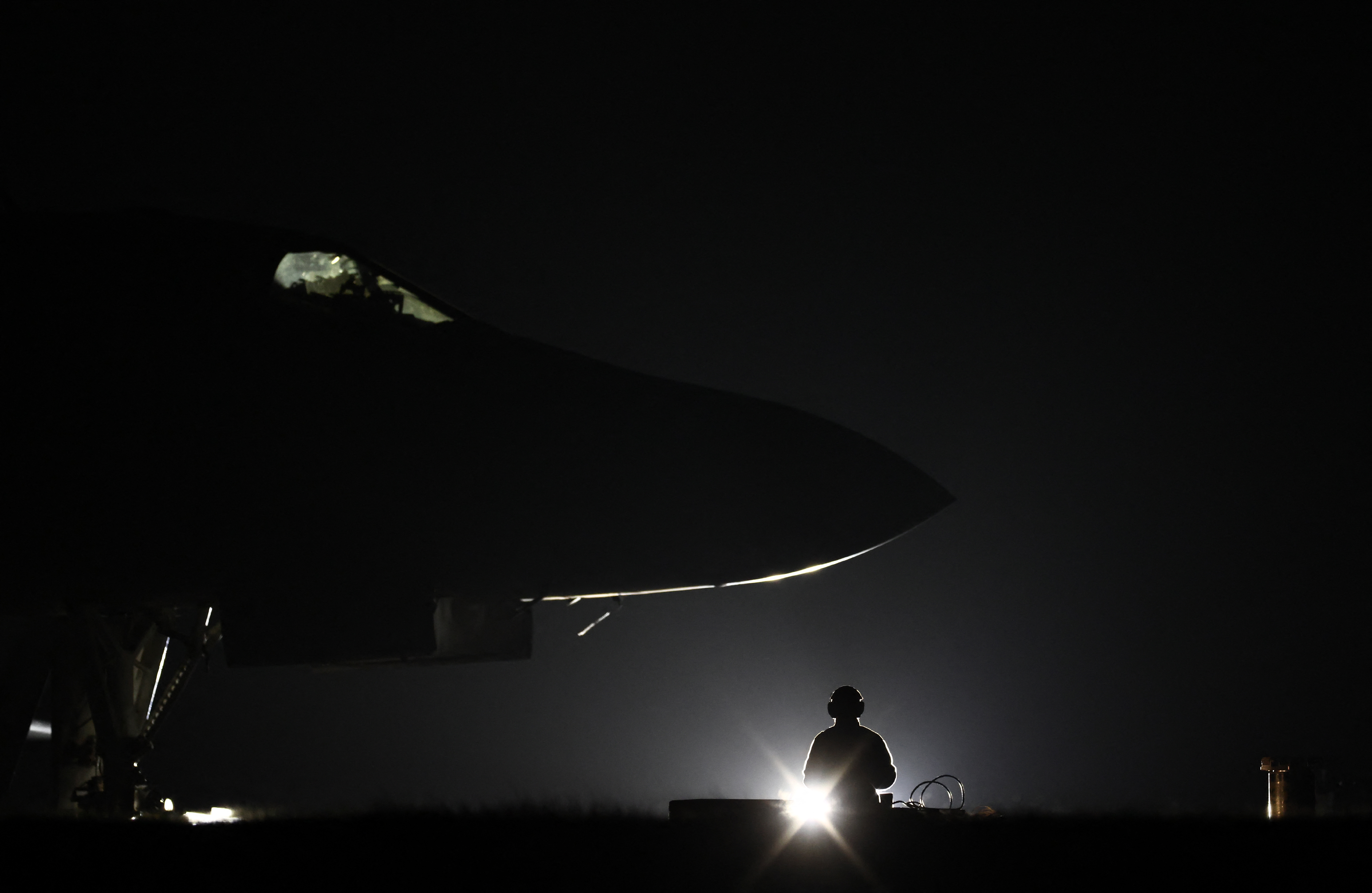 TOPSHOT - USAF military ground personnel load Joint Direct Attack Munitions (JDAM) into a US Air Force (USAF) B-1 Lancer bomber on the tarmac at RAF Fairford in south-west England on March 11, 2026.