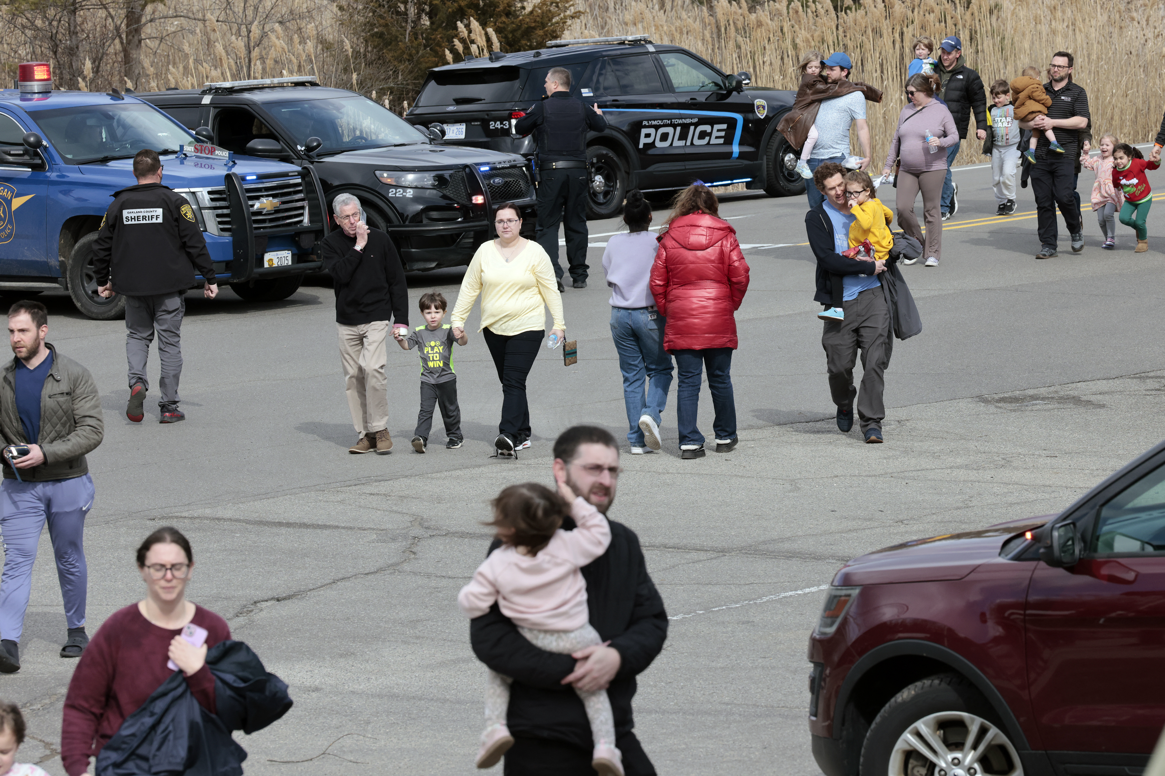 Families leave Temple Israel synagogue.