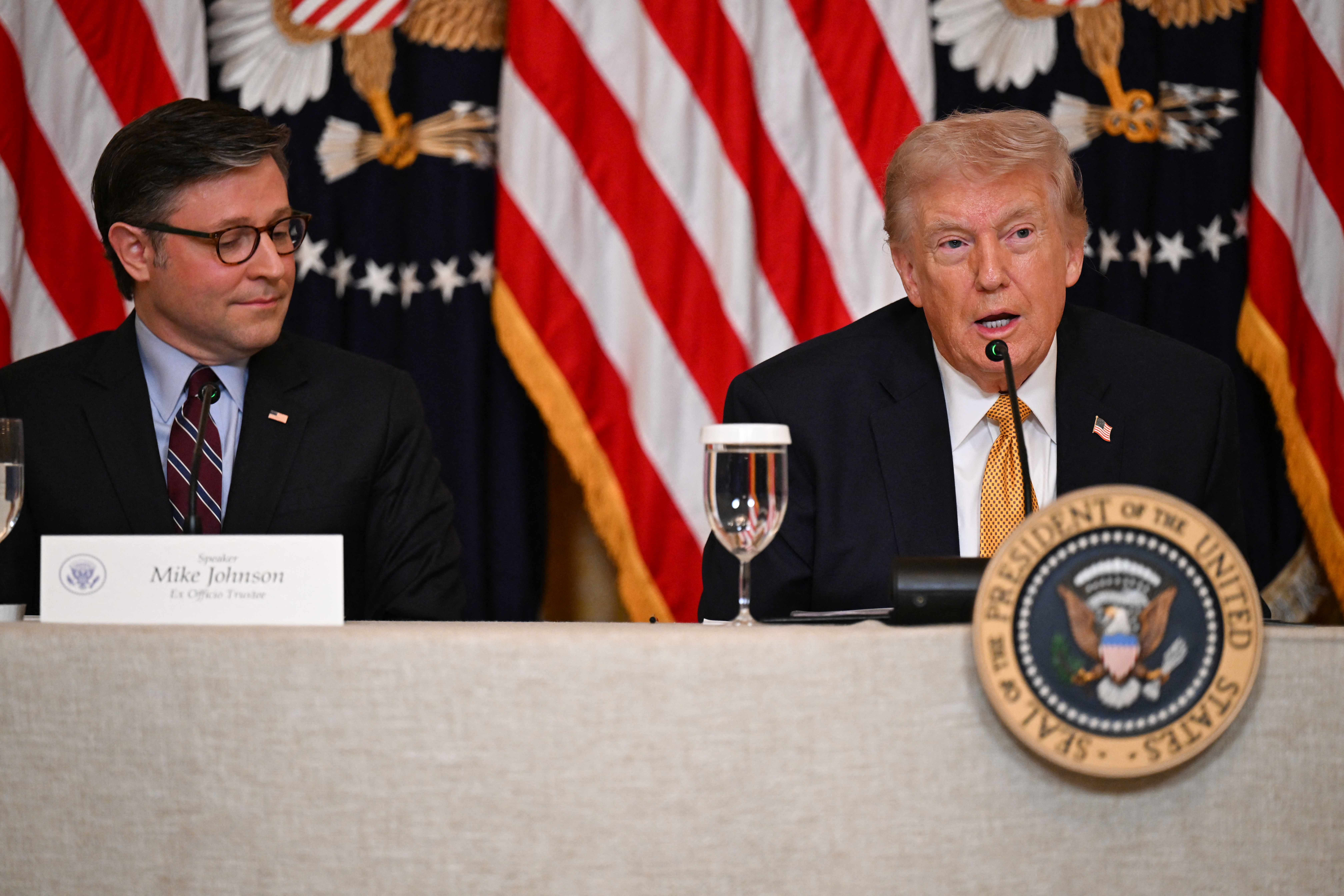 US President Donald Trump hosts a lunch with the Kennedy Center Board members as House Speaker Mike Johnson looks on at the White House in Washington, DC, on March 16, 2026. (Photo by Annabelle GORDON / AFP)