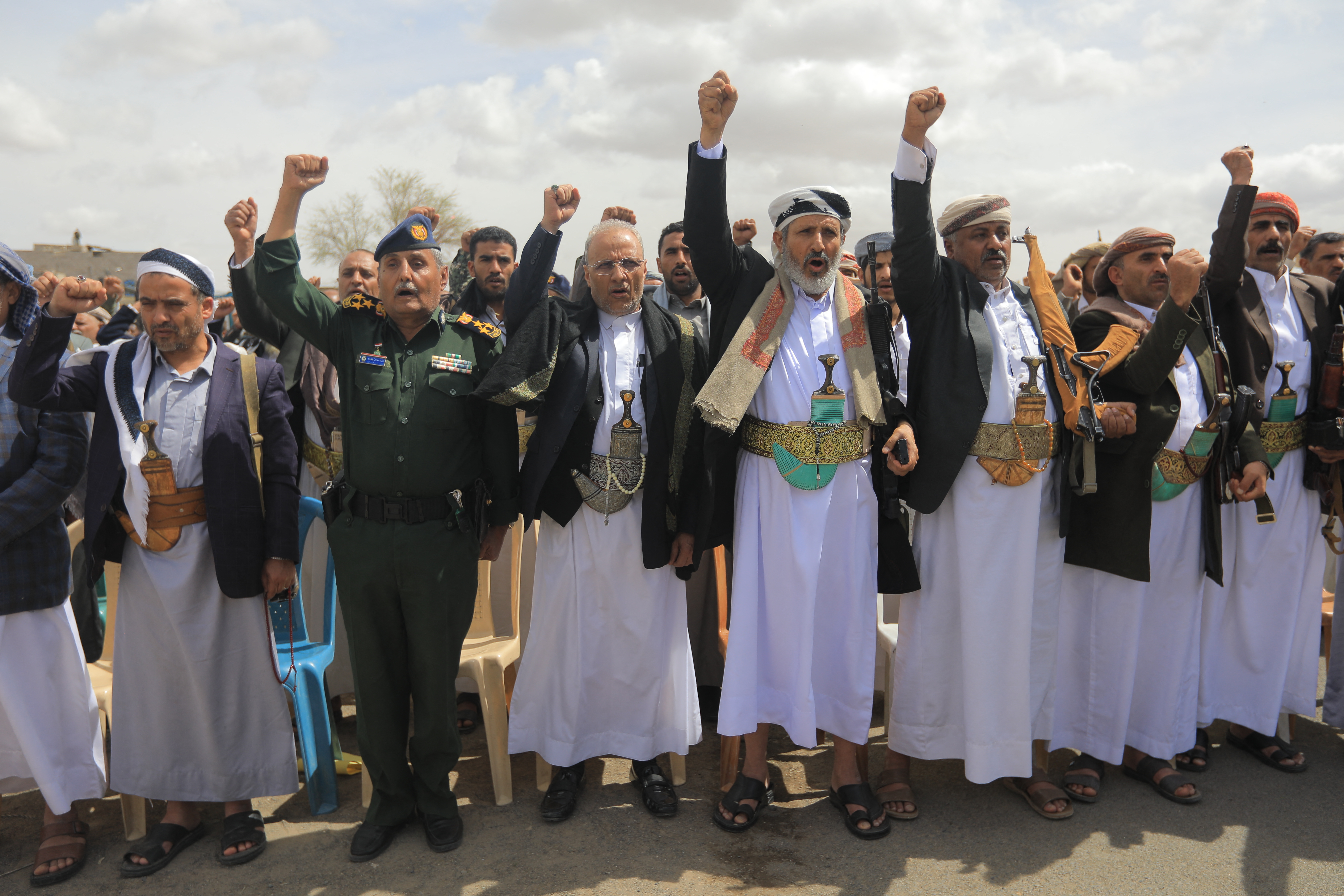 Supporters of Yemen's Huthi movement attend an event commemorating the ninth anniversary of the Saudi-led intervention in their country, in the capital Sanaa on March 26, 2026. (Photo by Mohammed HUWAIS / AFP)