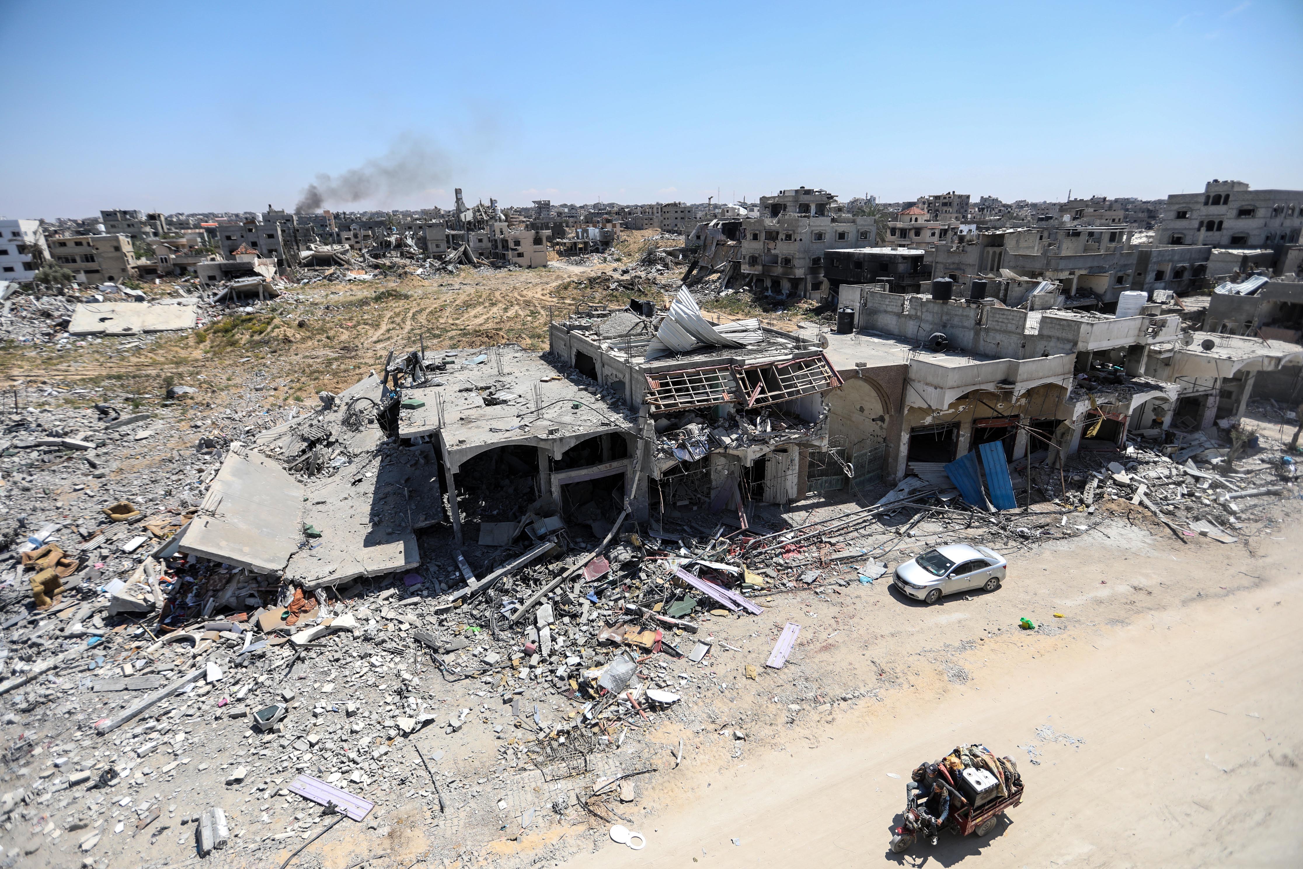 KHAN YUNIS, GAZA - APRIL 13: An aerial view of damage to homes following Israeli airstrikes on April 13, 2024 in Khan Yunis, Gaza. The Israeli military has scaled back ground troops in the southern Gaza Strip, leaving only one brigade. However Israeli officials have vowed to launch a ground invasion of Rafah at a later date.(Photo by Ahmad Hasaballah/Getty Images)