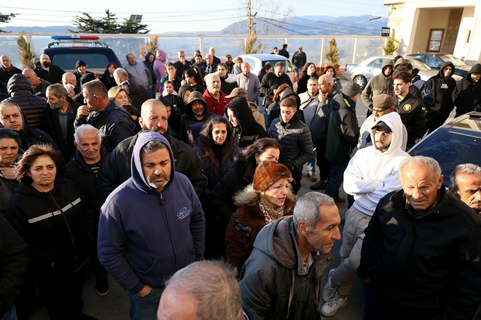 Residents gather outside the municipality hall to shows their anger for the death of the town&rsquo;s pastor by an Israeli shell that targeted his home, in the southern Lebanese border town of Al-Qlayaa on March 9, 2026. [Rabih Daher/AFP]