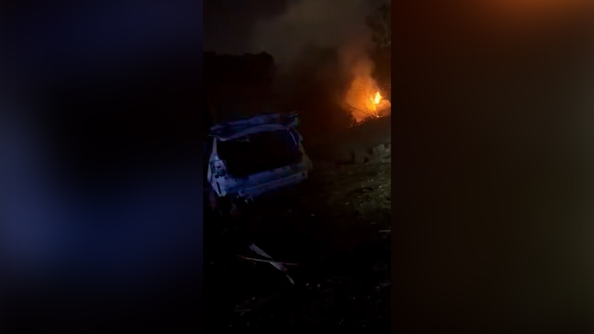 A fire and badly damaged vehicle are seen after an Iranian missile struck a residential area of northern Israel on March 13, 2026. [fireisrael7777 via Telegram]