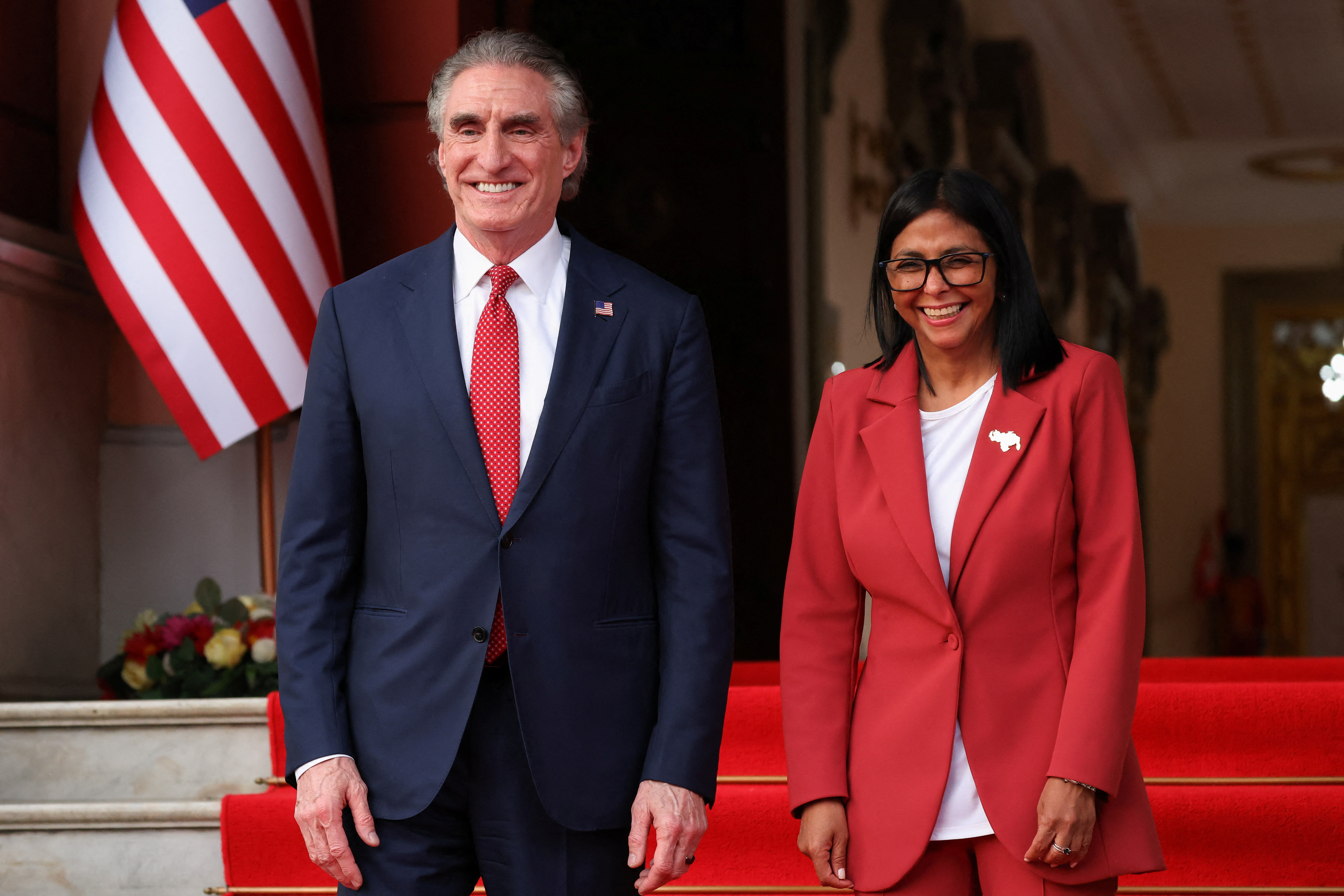 Venezuela's interim President Delcy Rodriguez and U.S. Interior Secretary Doug Burgum stand together as they attend to deliver statements at Miraflores Palace, in Caracas, Venezuela, March 4, 2026. REUTERS/Leonardo Fernandez Viloria