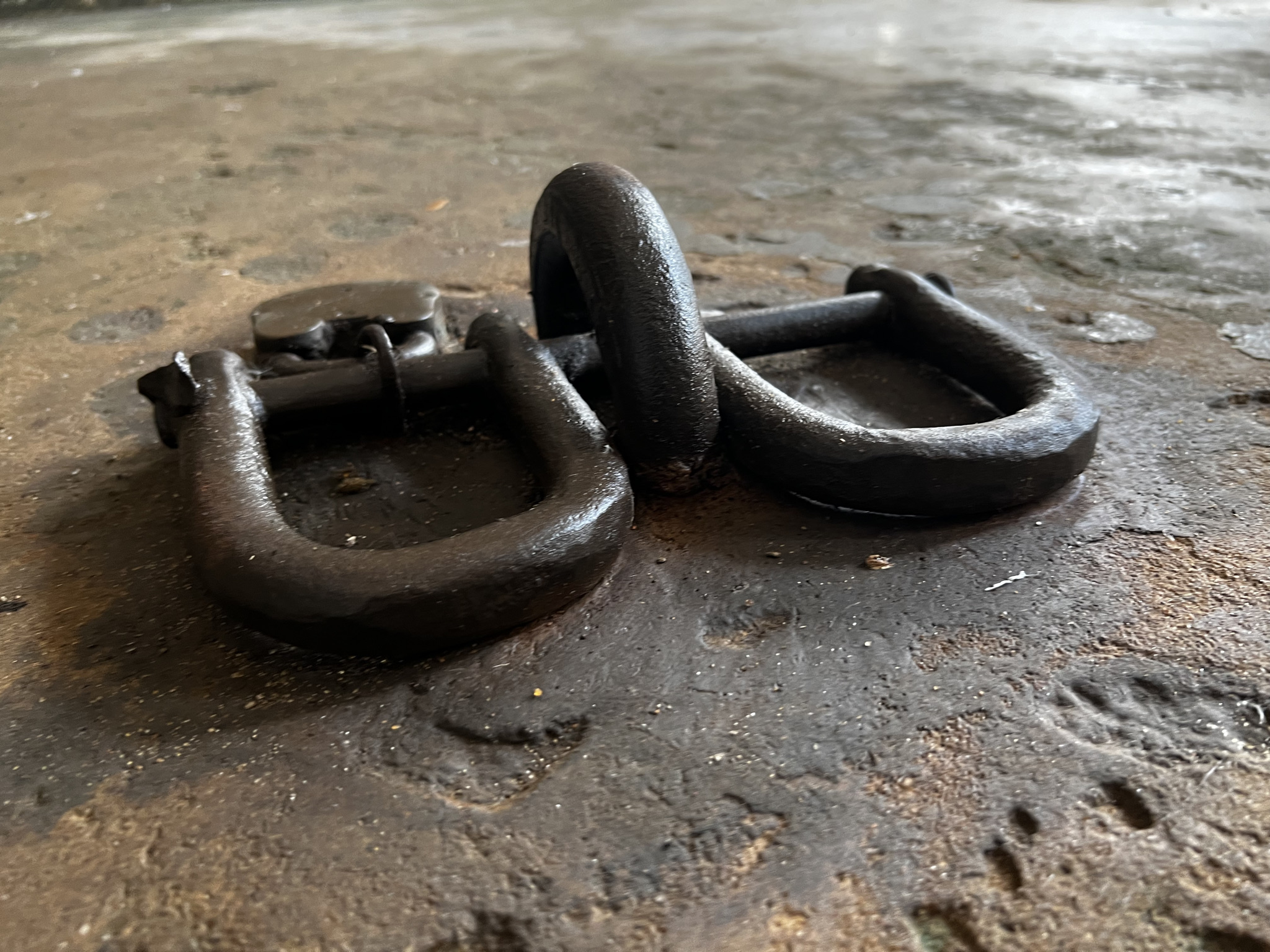 Ankle shackles used during the transatlantic slave trade at Fort Prinzenstein in Keta, Ghana on Aug 8, 2022. THOMSON REUTERS FOUNDATION/Nita Bhalla
