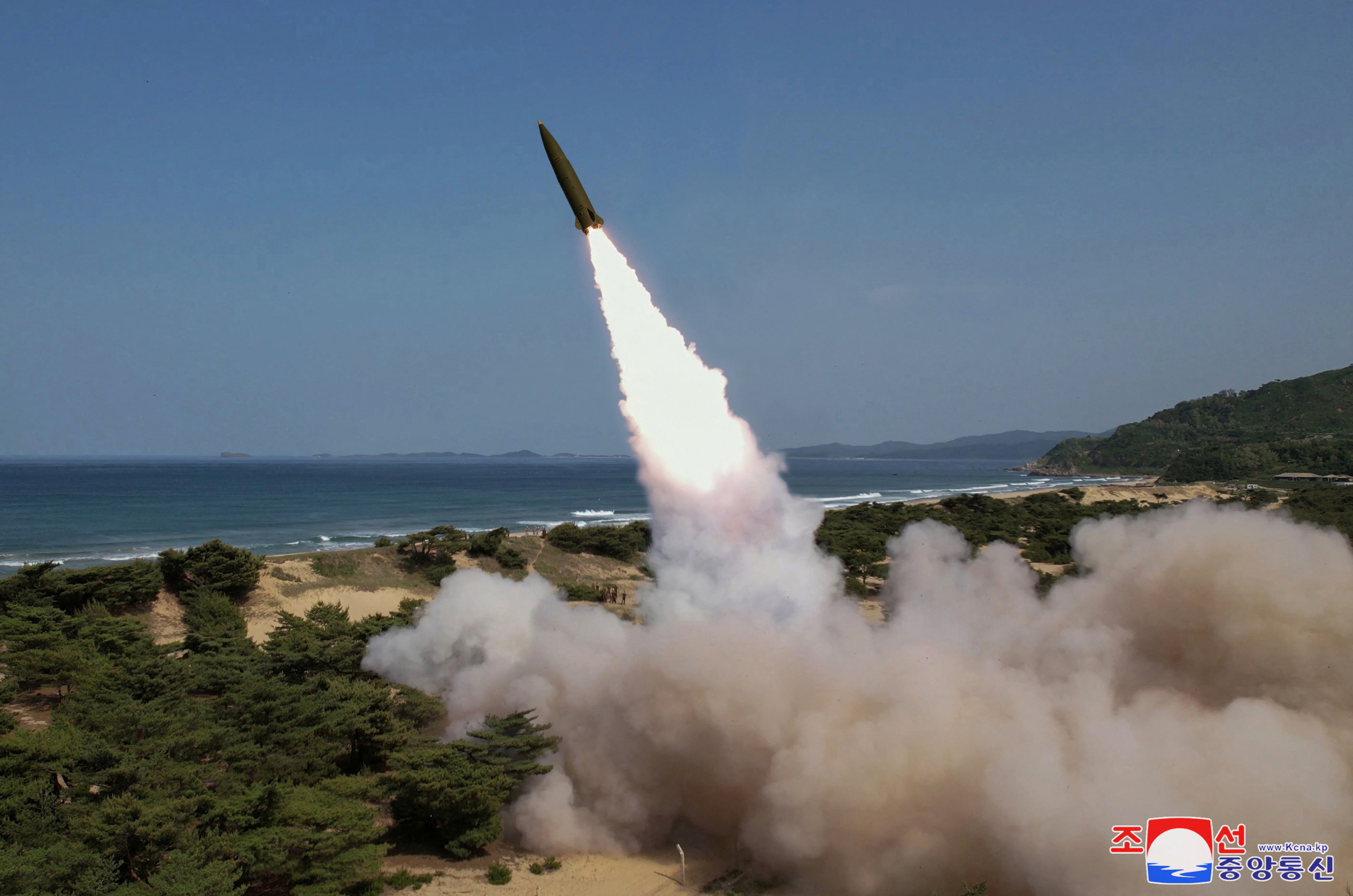 A missile is launched, as North Korea conducted a test firing of a tactical ballistic missile