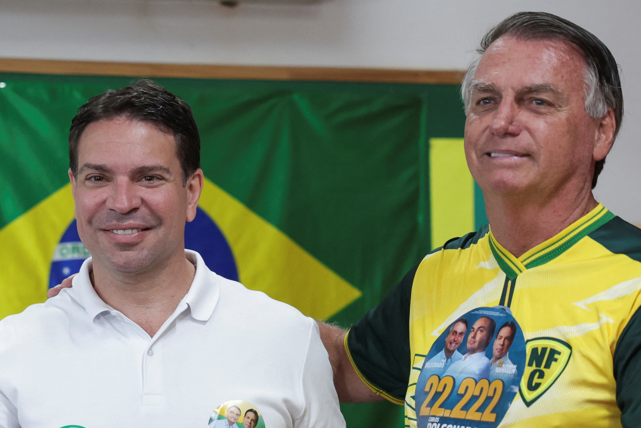 Brazil's former President Jair Bolsonaro poses with Rio de Janeiro's candidate for mayor Alexandre Ramagem after voting at a polling station during the municipal elections in Rio de Janeiro, Brazil, October 6, 2024.