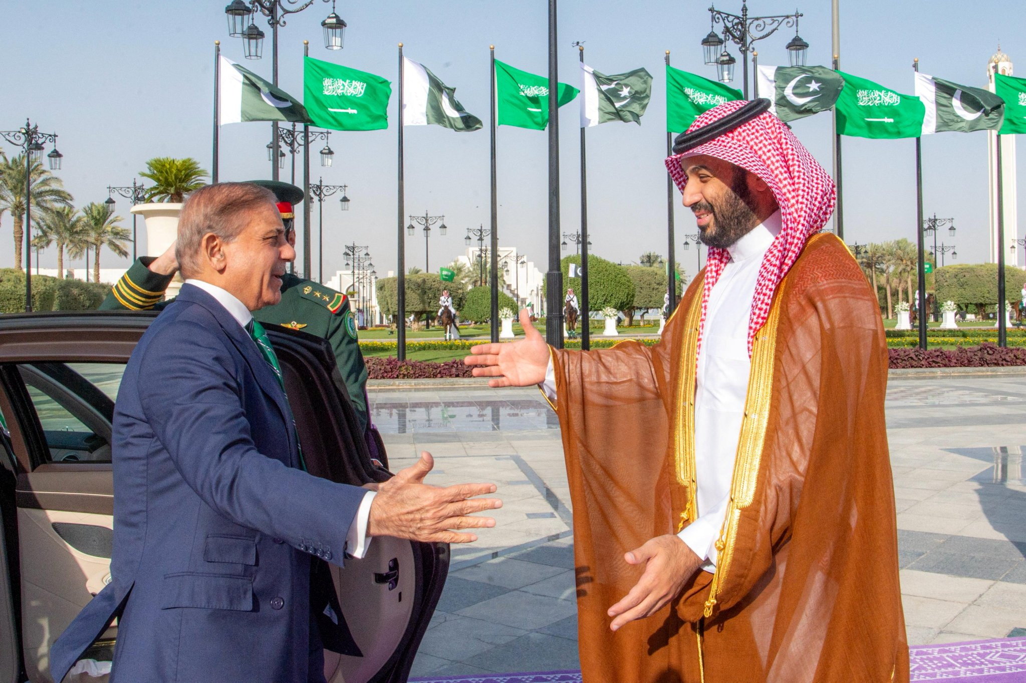 Saudi Crown Prince Mohammed bin Salman and Pakistan Prime Minister Shehbaz Sharif greet each other.