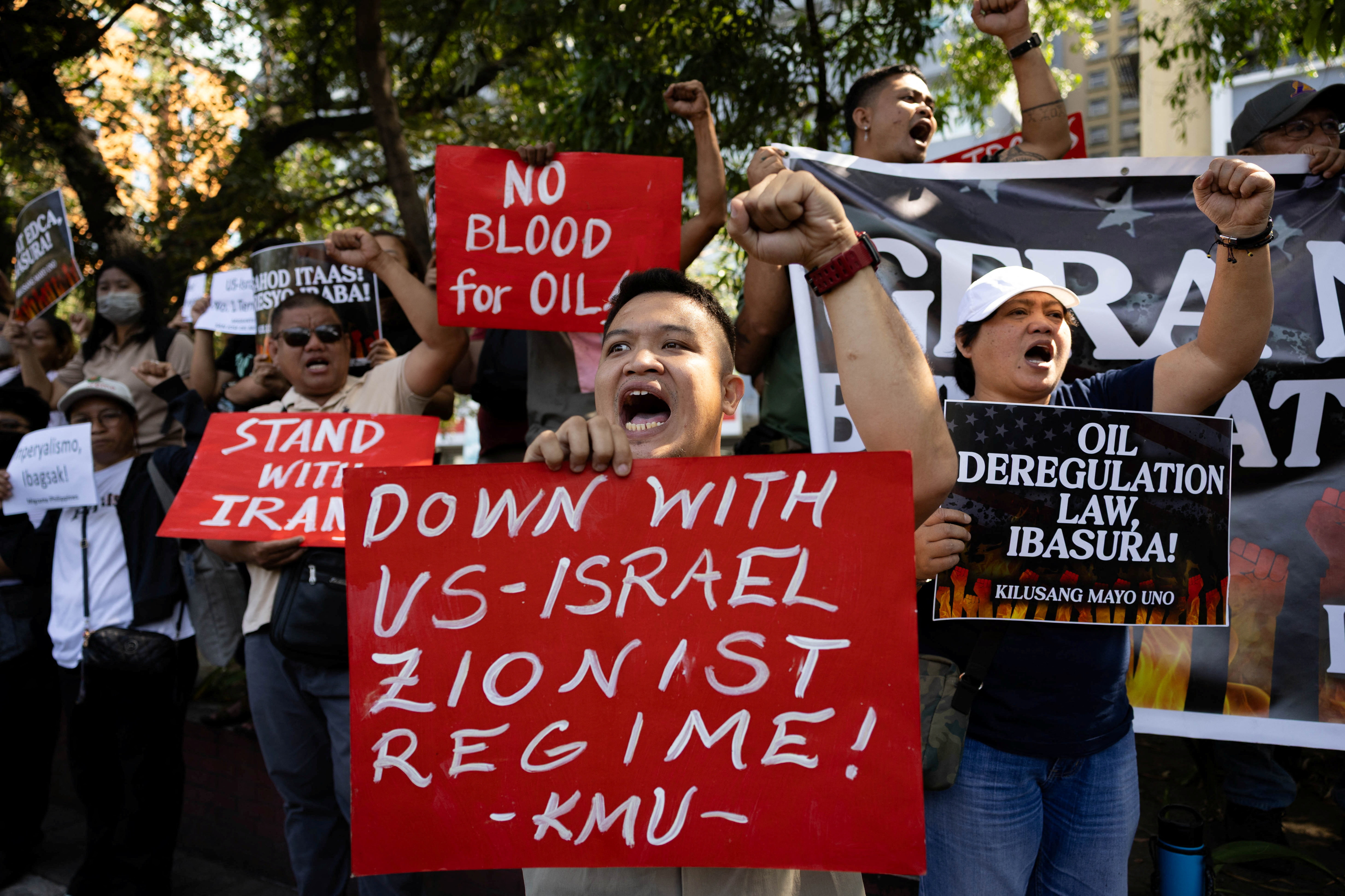 Filipino activists protest outside the U.S. Embassy amid the U.S.-Israel conflict with Iran and rising fuel prices, in Manila, Philippines, March 23, 2026. [Eloisa Lopez/Reuters]