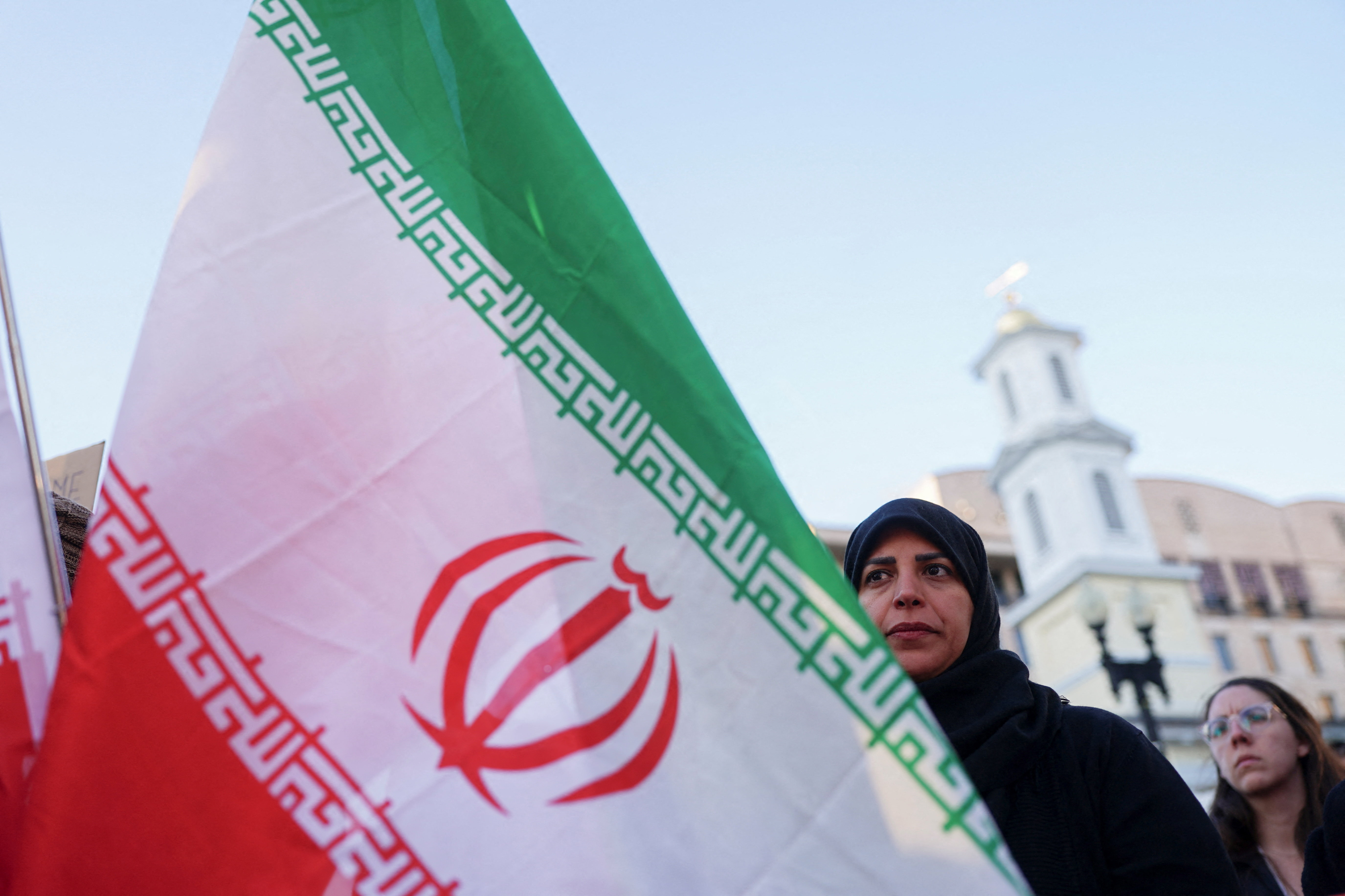 Demonstrators protest against military action in Iran.