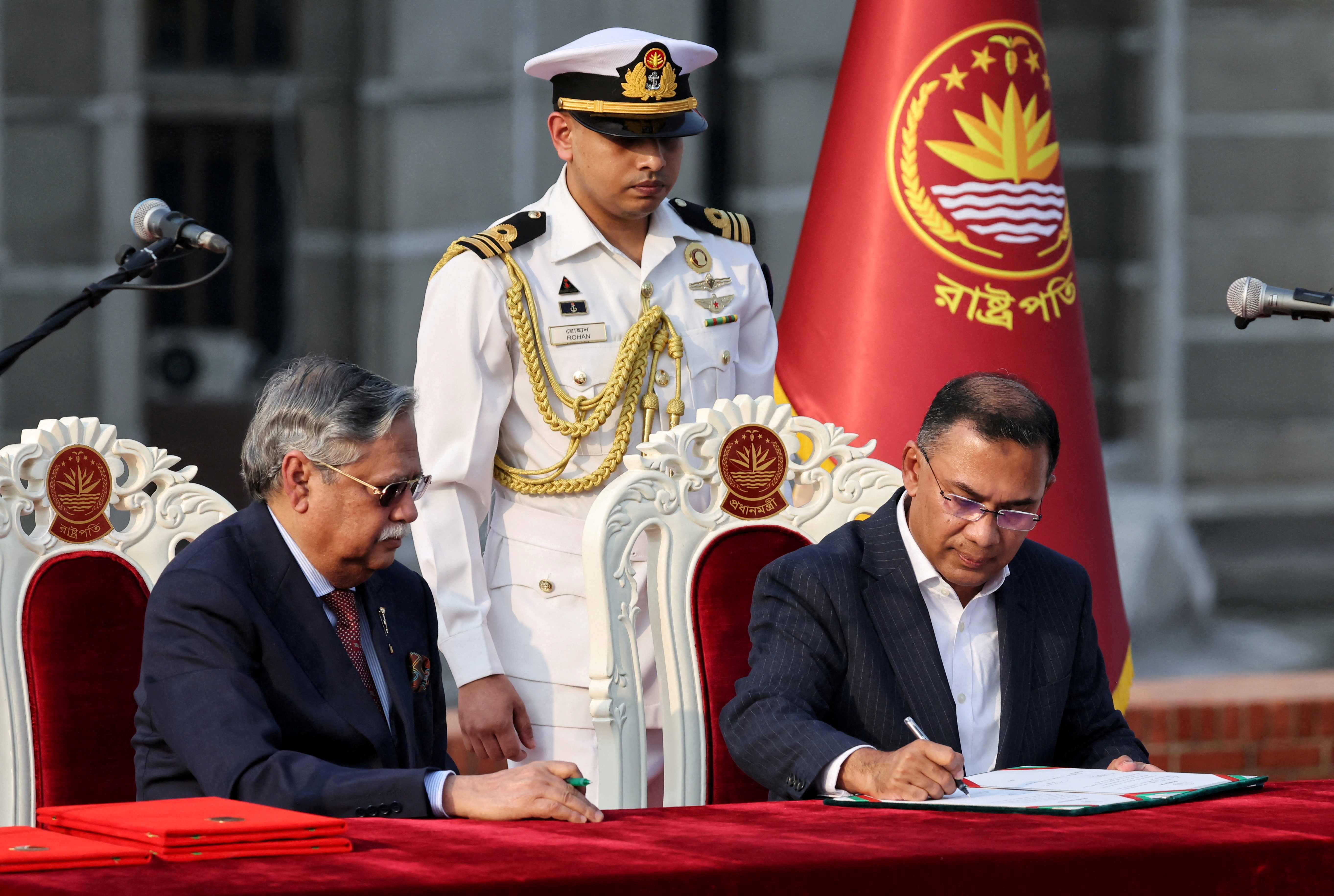 FILE PHOTO: Tarique Rahman signs in as the new Prime Minister during an oath‑taking ceremony administered by Bangladesh’s President Mohammed Shahabuddin at the South Plaza of the parliament building, following the BNP’s landslide victory in the national polls, in Dhaka, Bangladesh, February 17, 2026. REUTERS/Mohammad Ponir Hossain/File Photo