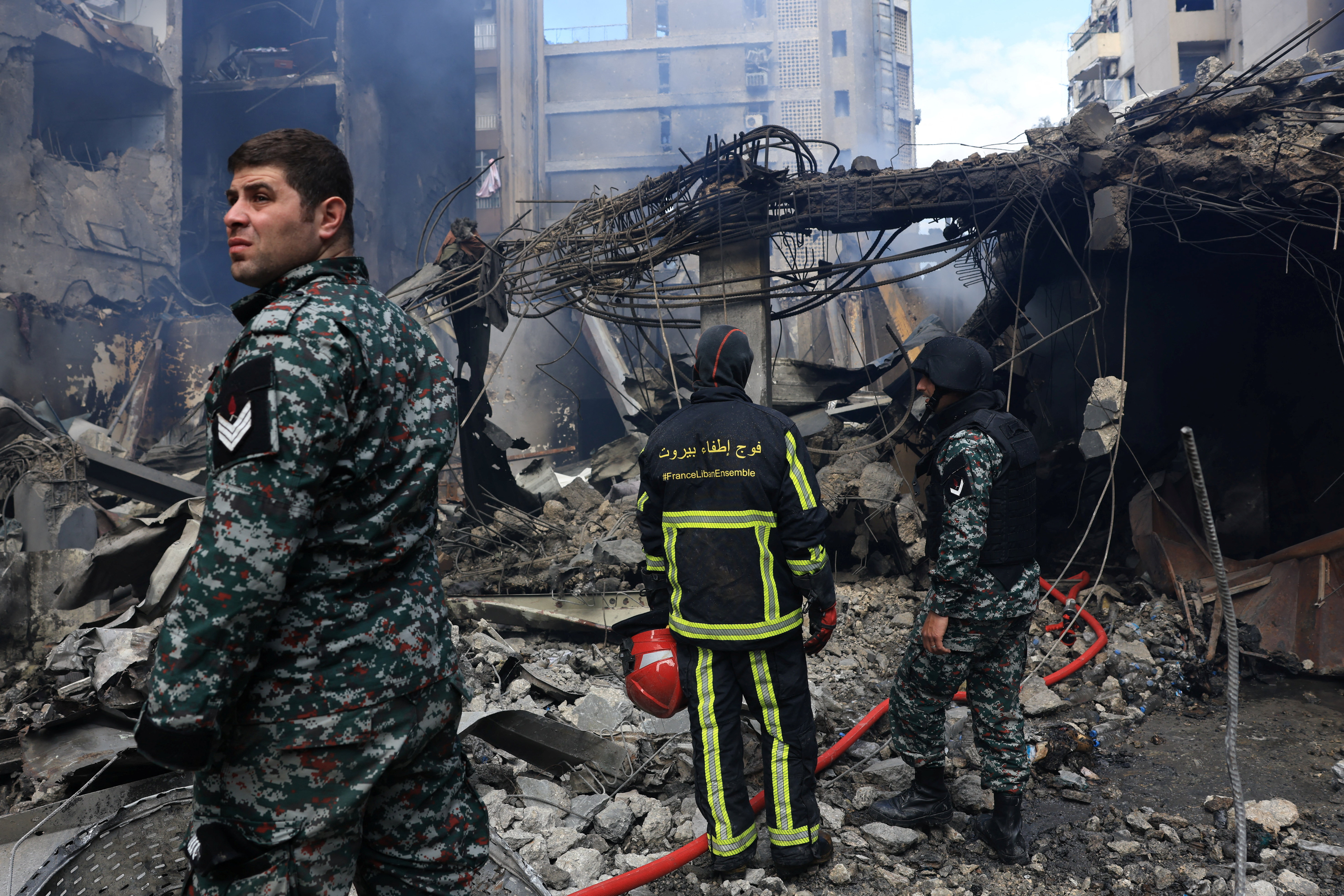 Rescuers stand at the site of an Israeli strike carried out on Wednesday, in Al-Mazraa in Beirut, Lebanon, April 9, 2026. REUTERS/Raghed Waked
