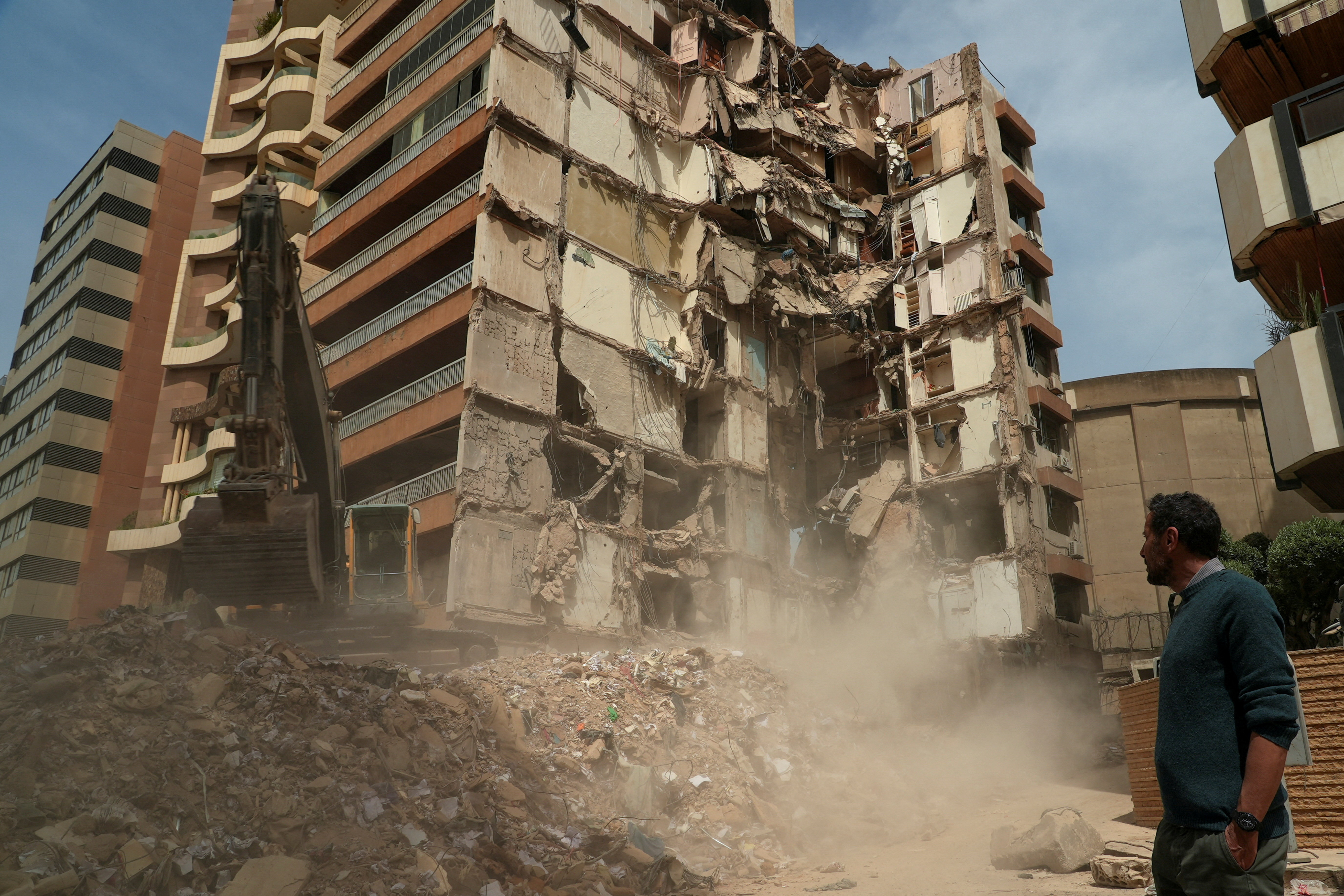 Wael Sabbagh, whose mother Afaf Sidaoui and brother Hassan, were killed in an Israeli strike on an apartment building on April 8, stands at the strike site in Tallet El Khayat in Beirut, Lebanon, April 15, 2026.