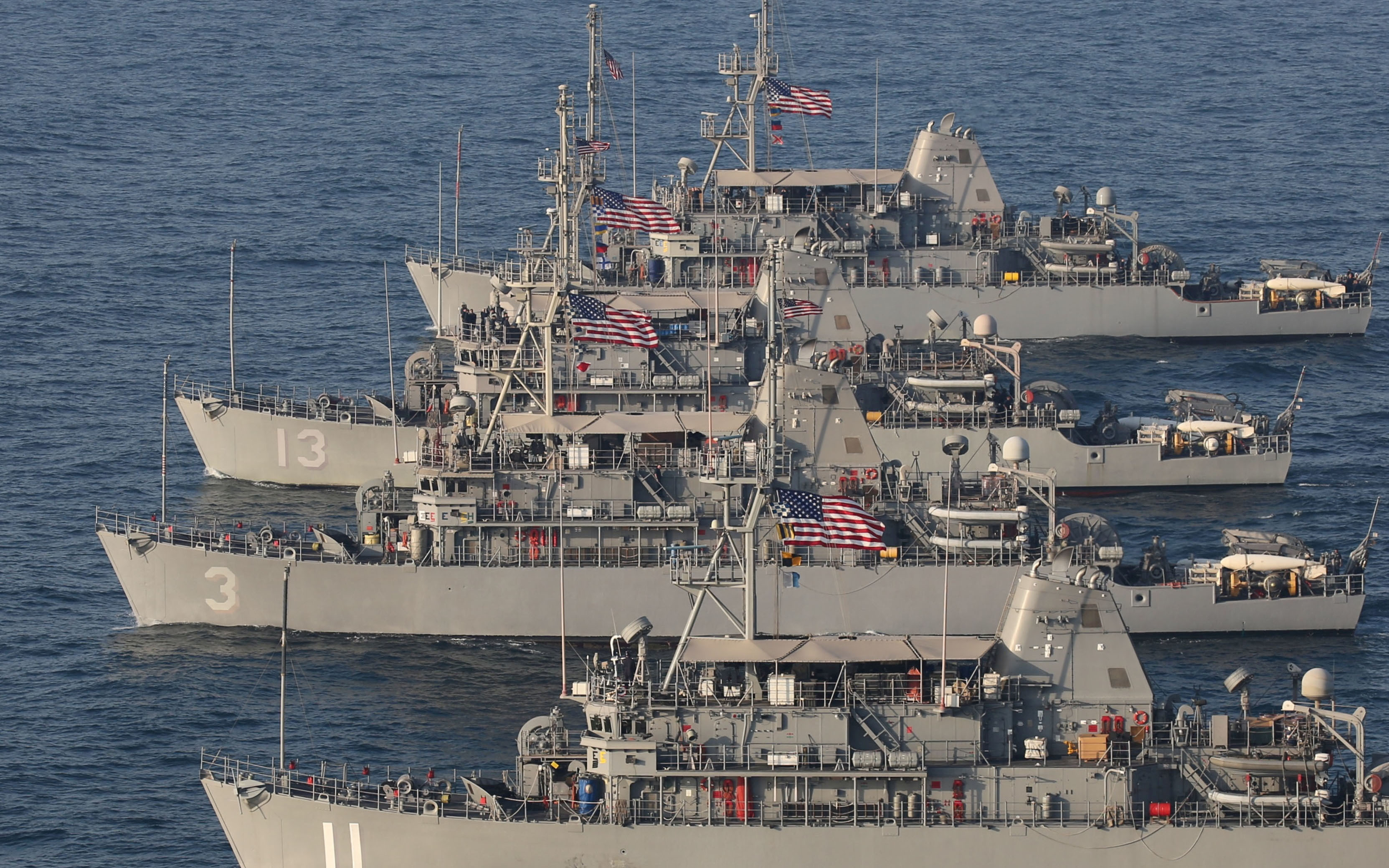 A formation of Avenger-class mine countermeasure ships in the Arabian Sea, July 6, 2019. [Antonio Gemma Moré/US Navy handout via Reuters]