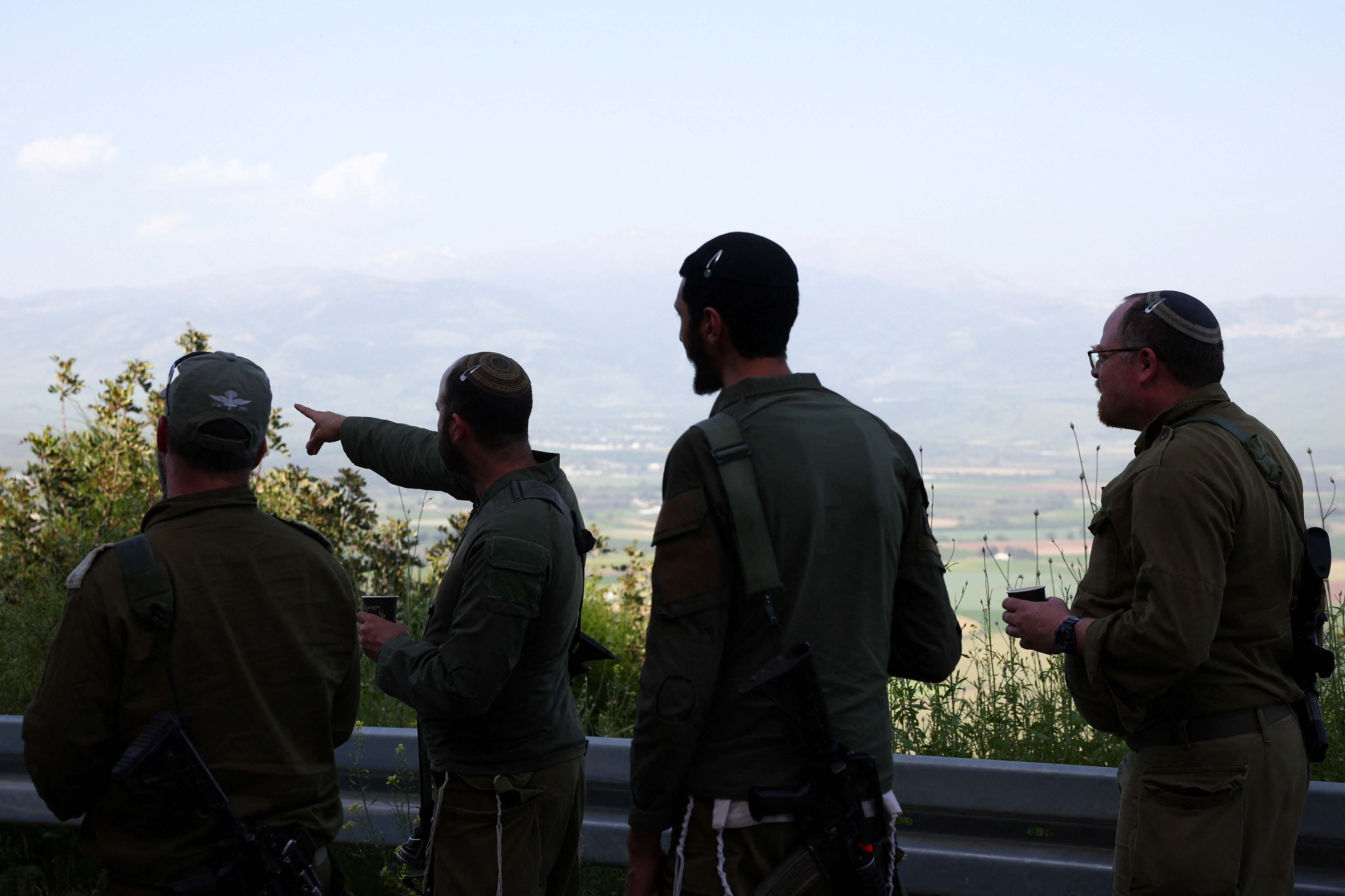 Israeli soldiers stand near the Israel-Lebanon border