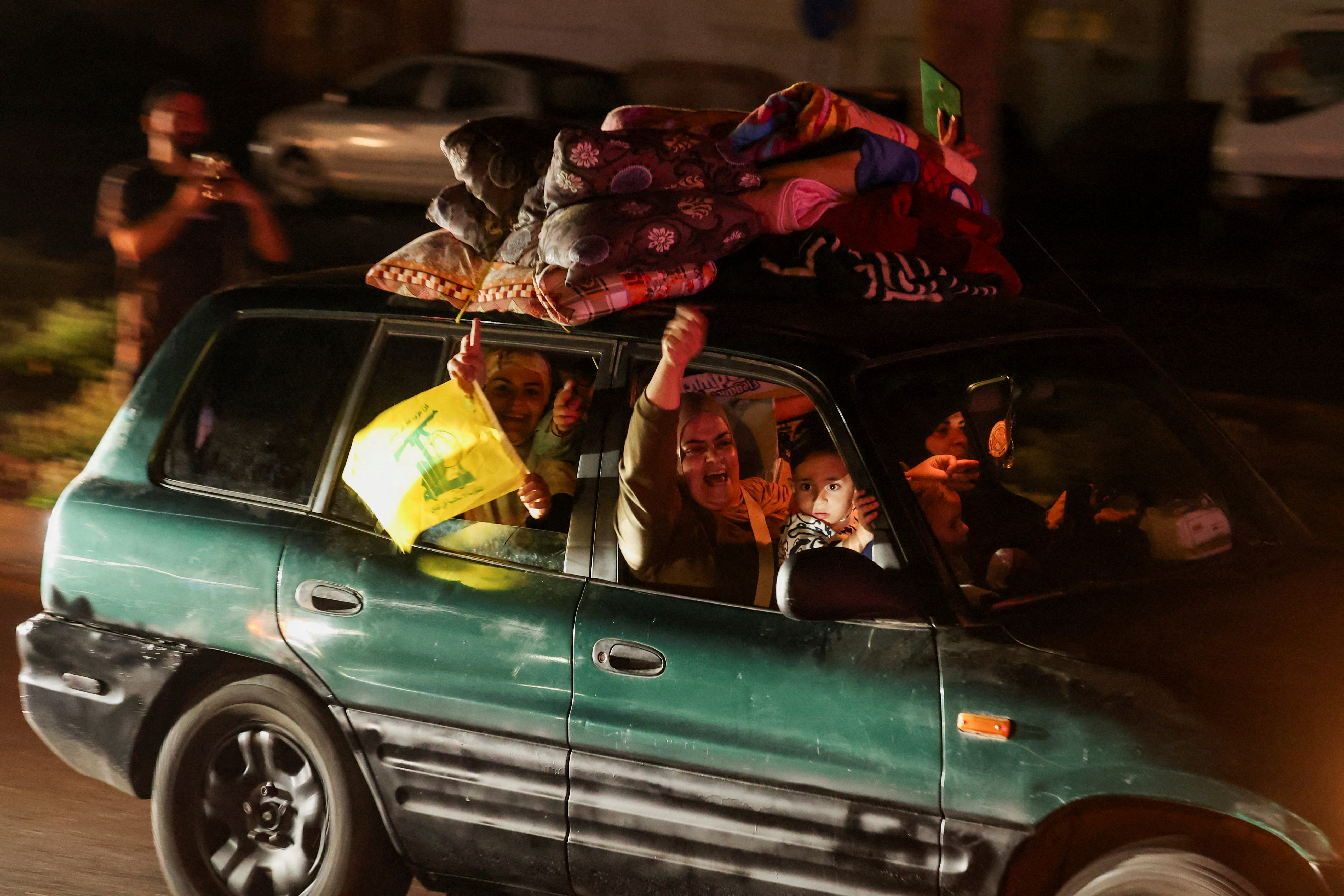Displaced people react as they return to their homes in a vehicle carrying belongings on its roof after a 10-day ceasefire between Lebanon and Israel went into effect, in Sidon, Lebanon, April 17, 2026. REUTERS/Aziz Taher TPX IMAGES OF THE DAY