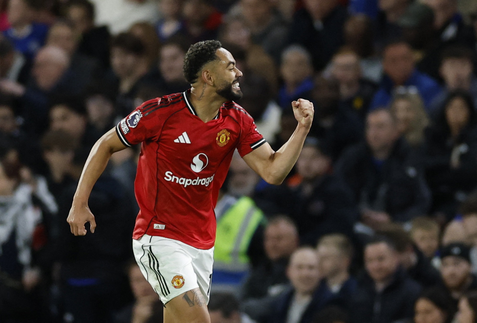 Manchester United's Matheus Cunha celebrates scoring their first goal