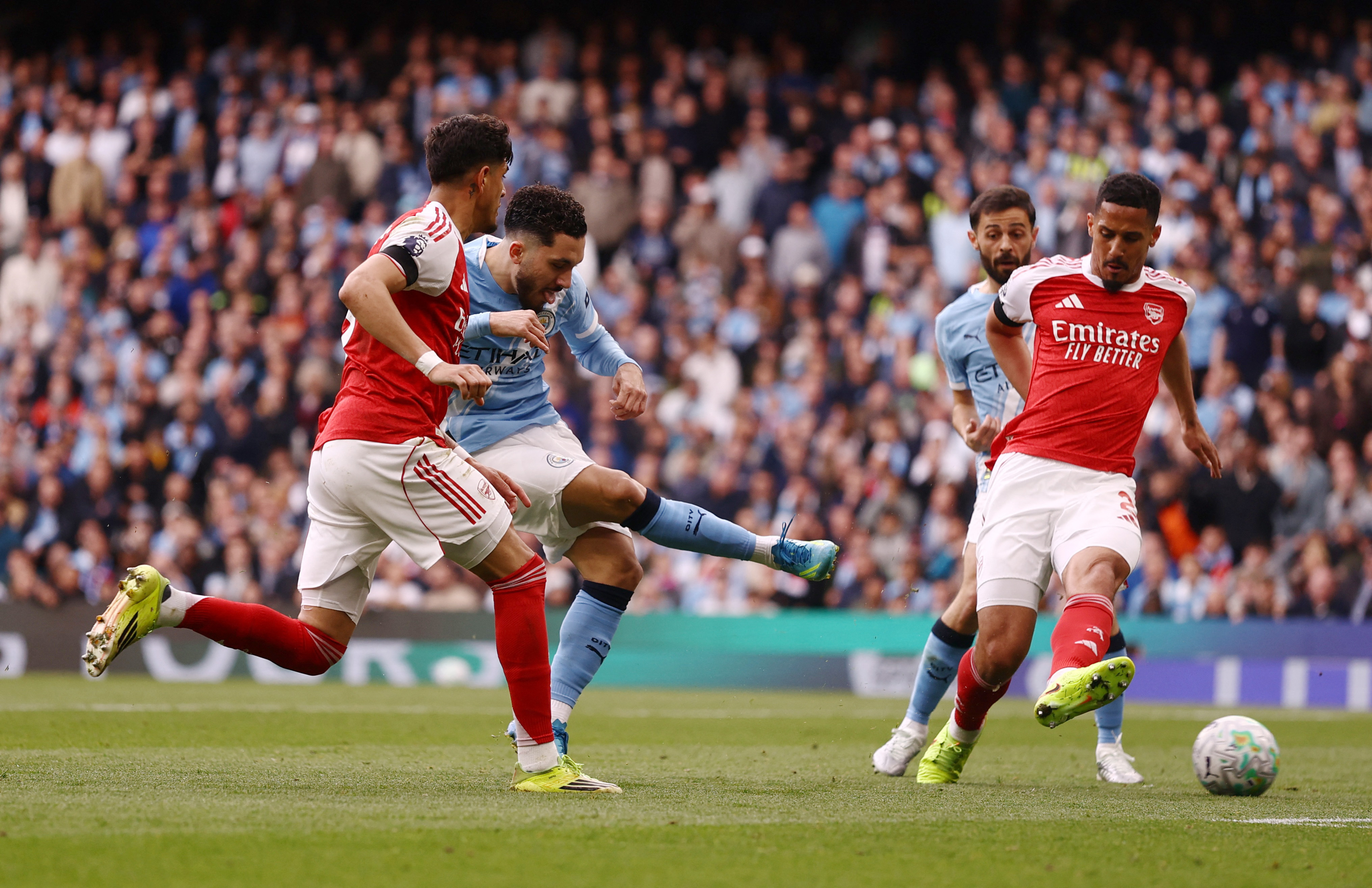 Soccer Football - Premier League - Manchester City v Arsenal - Etihad Stadium, Manchester, Britain - April 19, 2026 Manchester City's Rayan Cherki scores their first goal Action Images via Reuters/Lee Smith EDITORIAL USE ONLY. NO USE WITH UNAUTHORIZED AUDIO, VIDEO, DATA, FIXTURE LISTS, CLUB/LEAGUE LOGOS OR 'LIVE' SERVICES. ONLINE IN-MATCH USE LIMITED TO 120 IMAGES, NO VIDEO EMULATION. NO USE IN BETTING, GAMES OR SINGLE CLUB/LEAGUE/PLAYER PUBLICATIONS. PLEASE CONTACT YOUR ACCOUNT REPRESENTATIVE FOR FURTHER DETAILS..