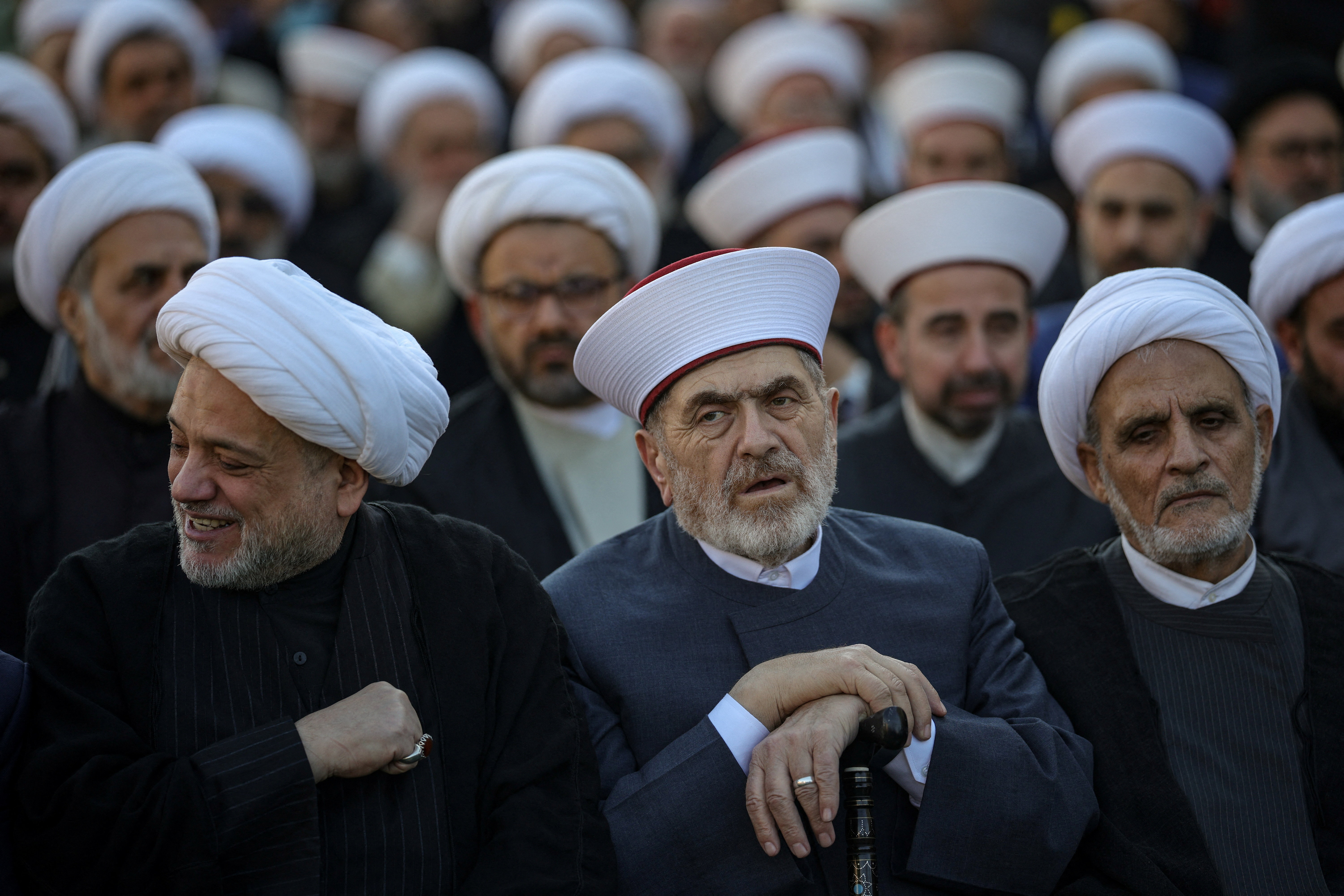 People attend a gathering to pay tribute to Iran’s supreme leaders.