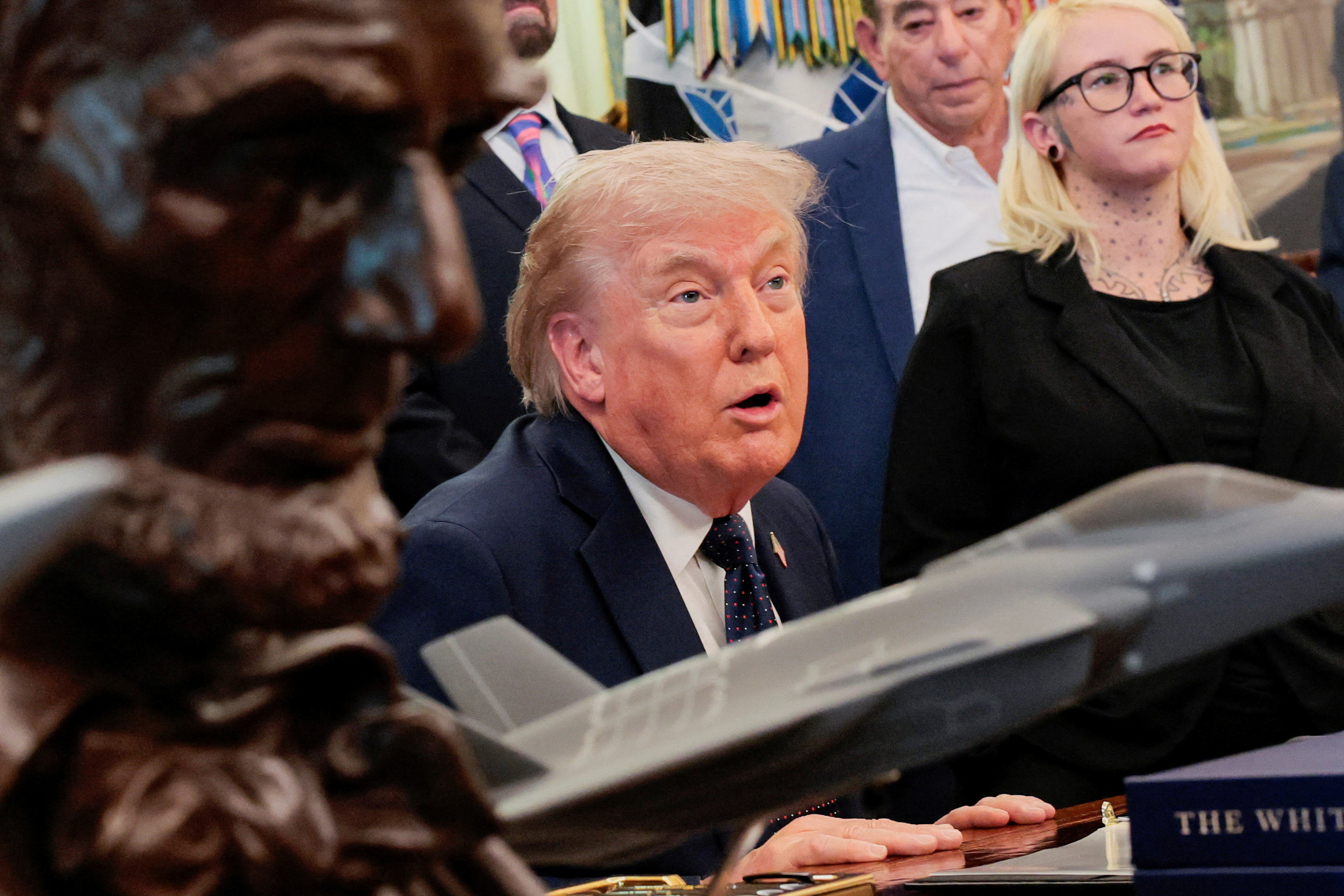 U.S. President Donald Trump speaks while sitting near a bust of Abraham Lincoln during a healthcare affordability event in the Oval Office at the White House in Washington, D.C., U.S., April 23, 2026. [Kylie Cooper/Reuters]