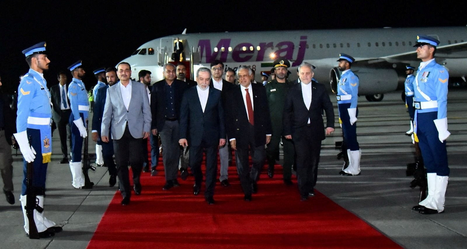 Iranian Foreign Minister Abbas Araqchi walks with Pakistan's Foreign Minister Mohammad Ishaq Dar and Army Chief