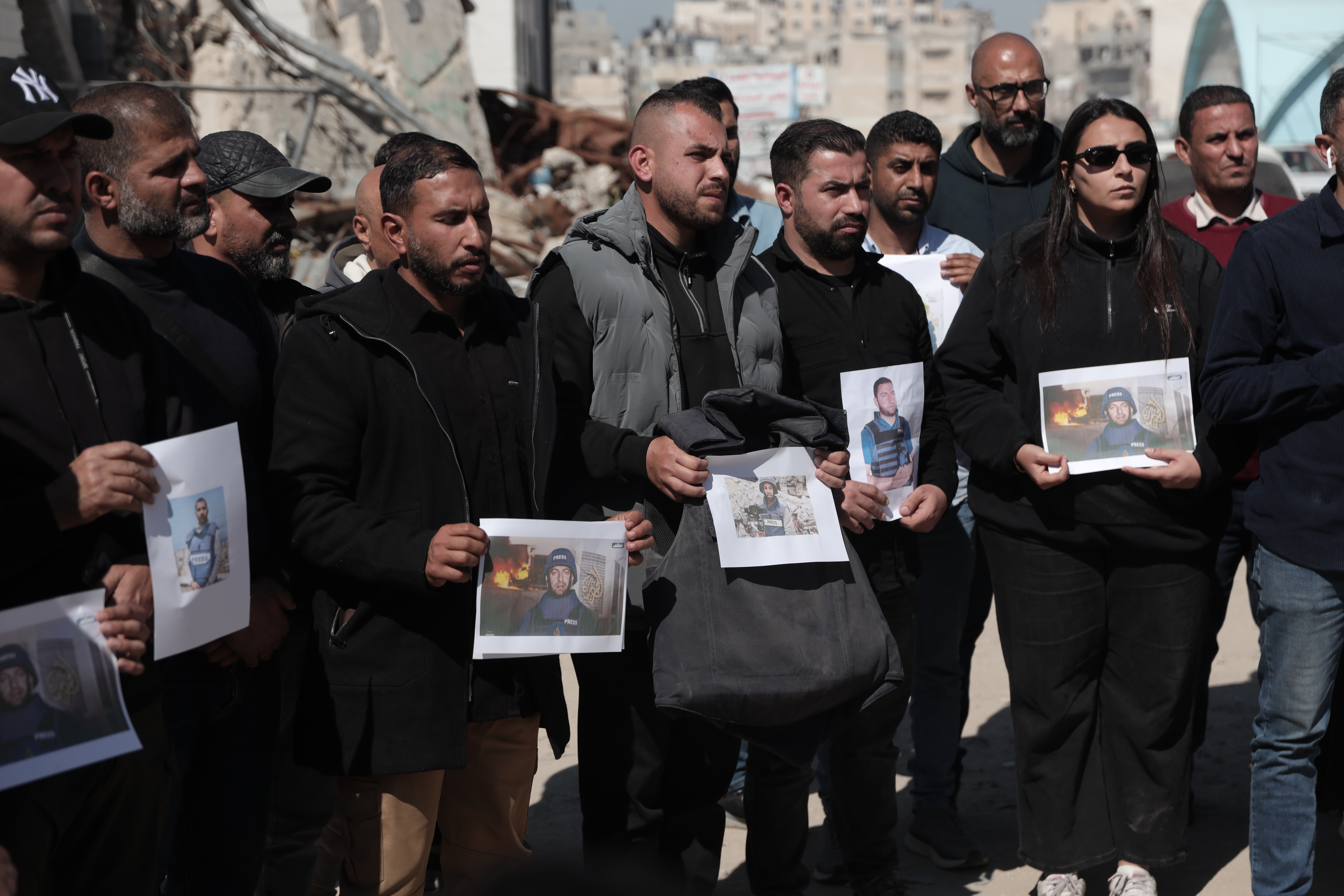 Journalists in Gaza hold a vigil condemning the killing of Al Jazeera Mubasher correspondent Mohammed Wishah and ongoing attacks on media workers [Abdelhakim Abu Riash/ Al Jazeera]